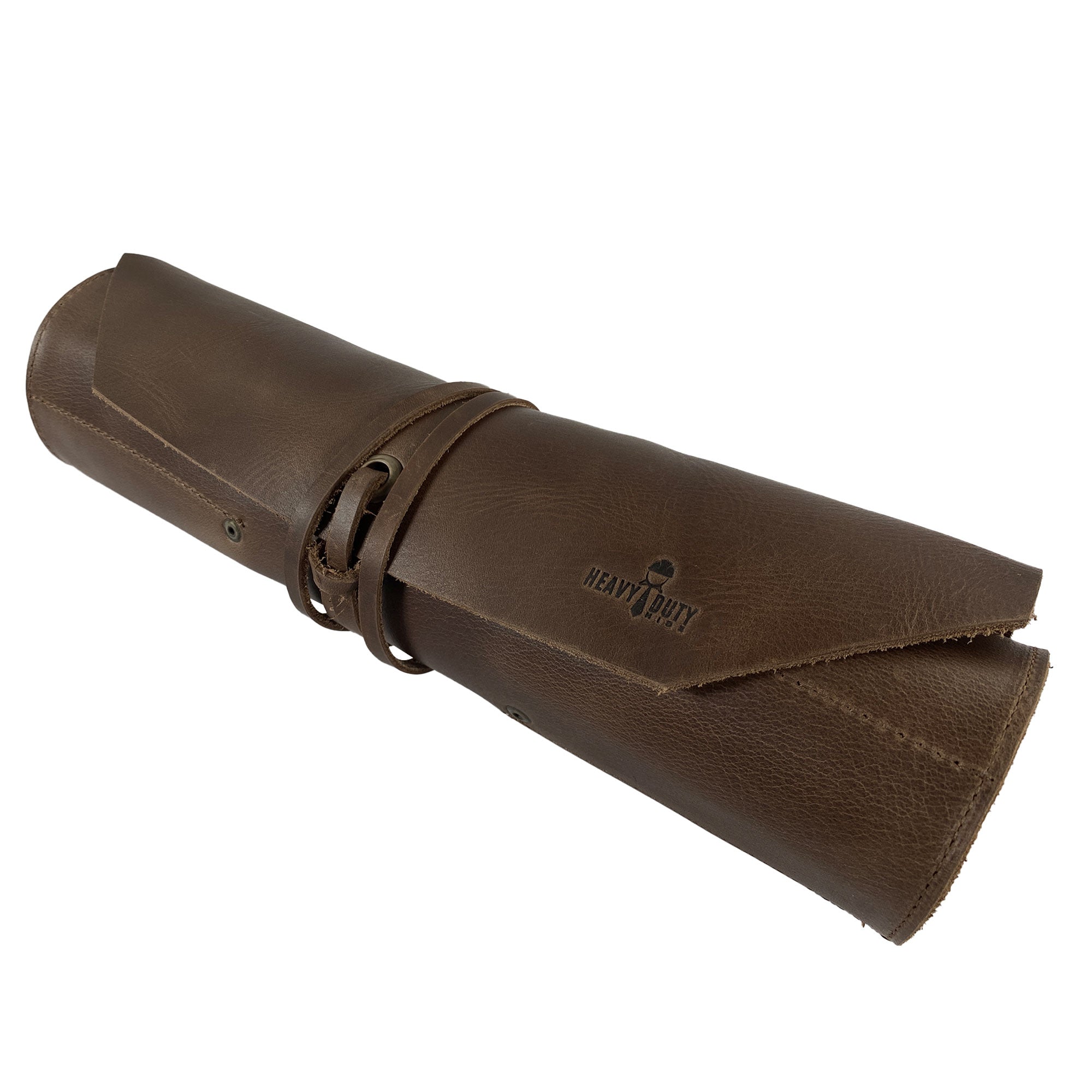 The rolled-up version of the 12 Pocket Tool Roll - Home Storage by Heavy Duty Hide, elegantly showcasing its sturdy Full Grain Leather and hand-branded logo. This artisan-crafted Big Tool Roll Up Bag is perfect for organizing woodworking tools, blending practicality with vintage style.