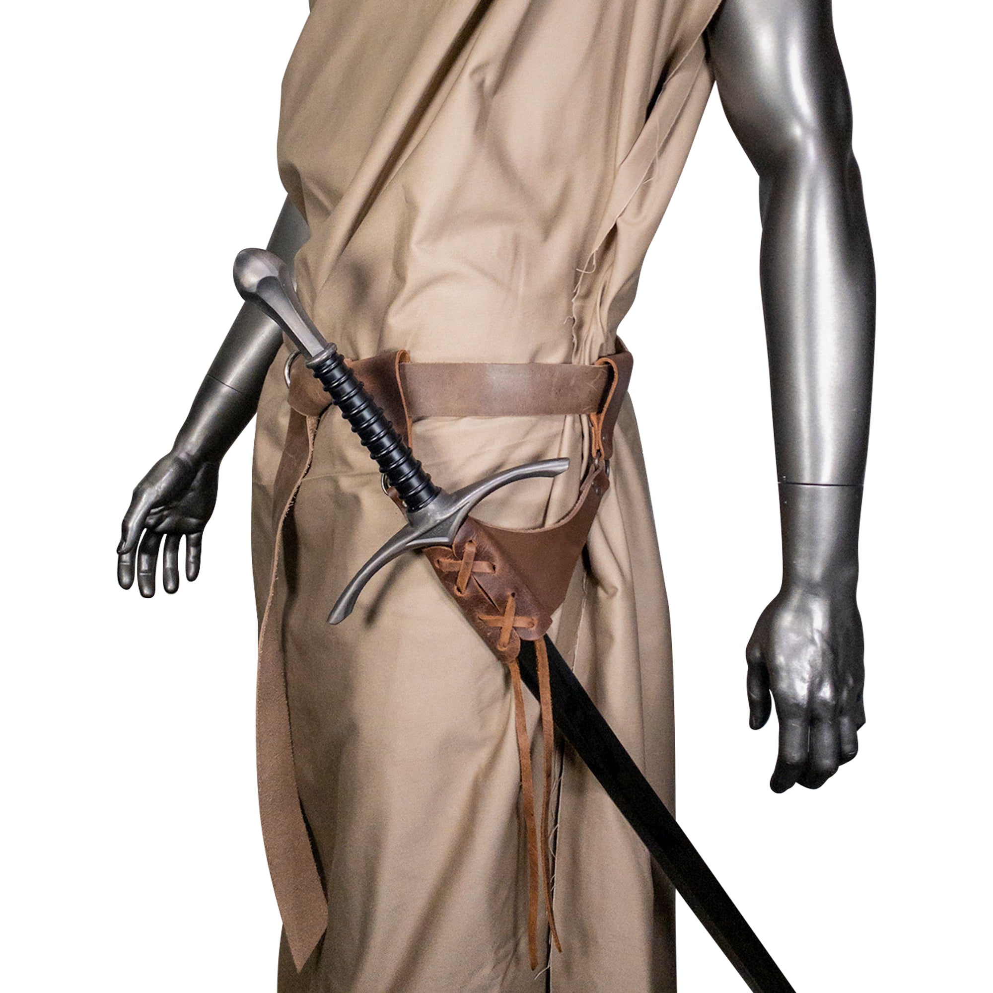 The Dangling Sword Holder by Hide & Play worn by a mannequin, demonstrating its stylish integration with a garment. This full grain leather piece is perfect for fantasy cosplay and historical costumes, showcasing handmade artisan quality produced in La Antigua Guatemala and Oaxaca Mexico.