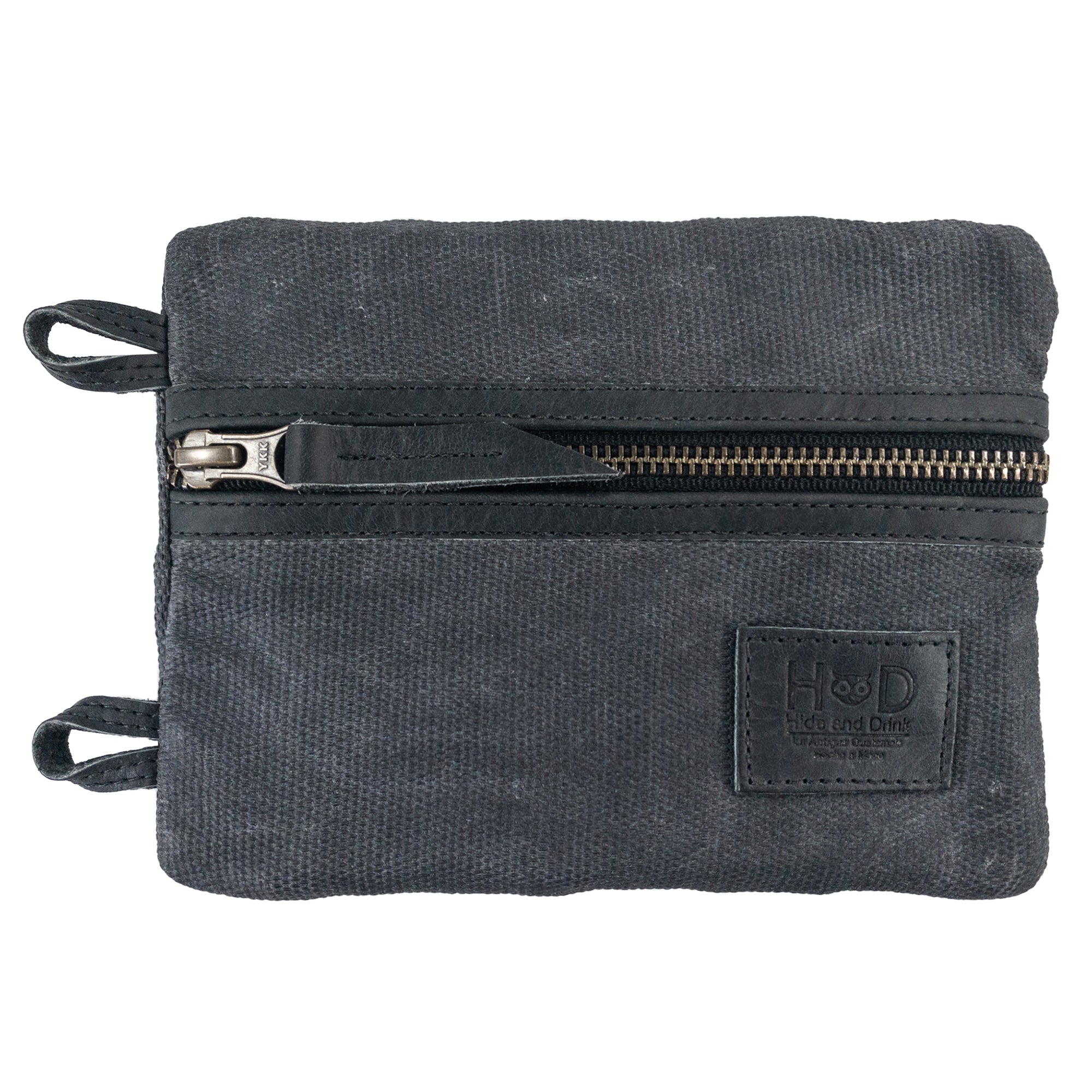 Side view of the black Multi-tool Pocket Pouch - XL by Hide & Drink, highlighting the zippered closure designed for easy access to tools and hardware. Multi-Tool Pocket Pouch XL, Compact Multipurpose EDC Zippered Bag, Mini Camping Tool Case, Knife Holster, Handmade Slim Organizer, Waxed Canvas, StockyardX, Small Batch Production, Artisan, Handmade in La Antigua Guatemala & Oaxaca Mexico.