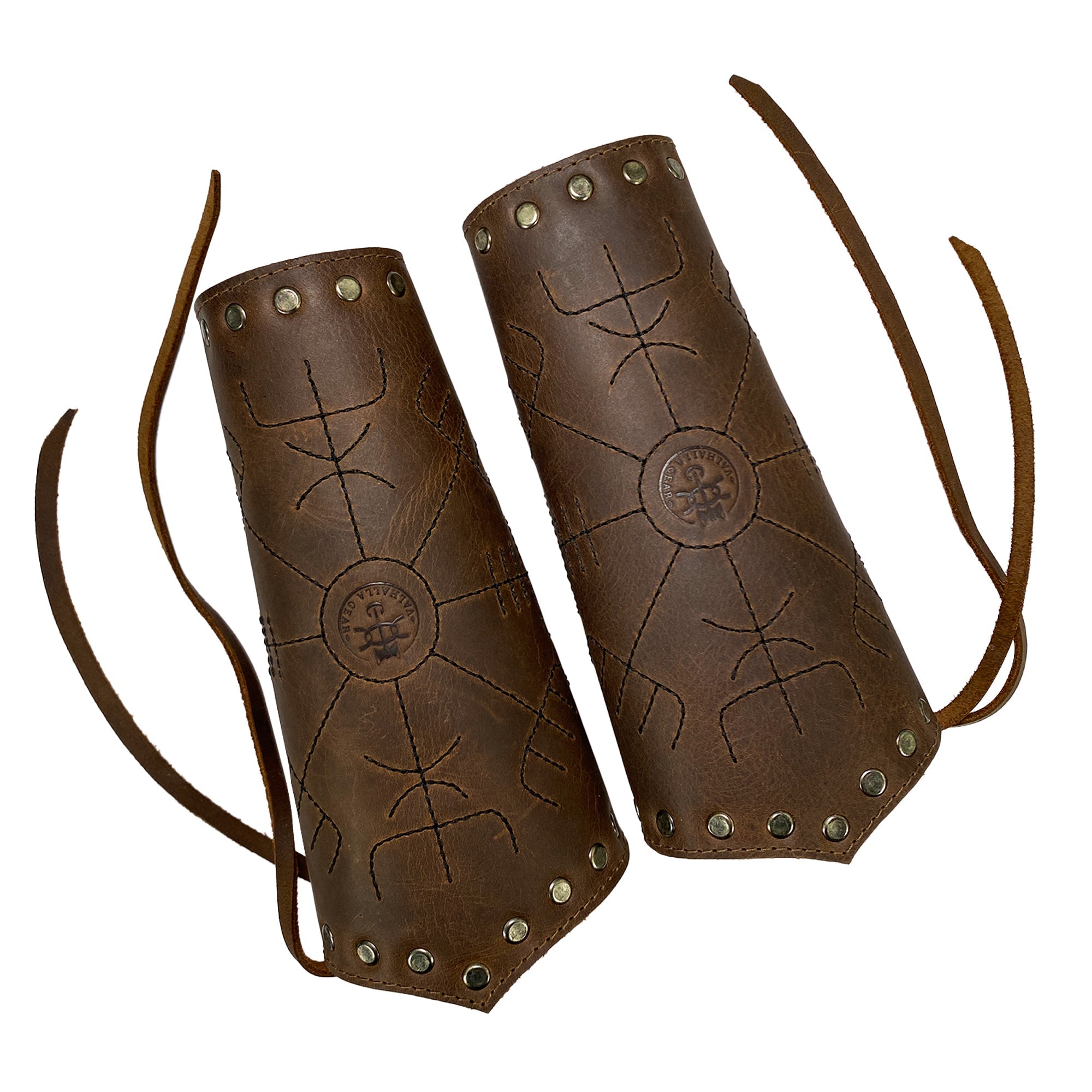 Viking Bracers from Valhalla Gear presented with intricate detailing and adjustable ties, perfect for archery. This Viking Bracer (2 pack) encapsulates Viking style hand protection with its durable design. Made from full grain leather, hand cut and sewn in La Antigua Guatemala, each artisan piece is fire branded, representing craftsmanship and small batch production.