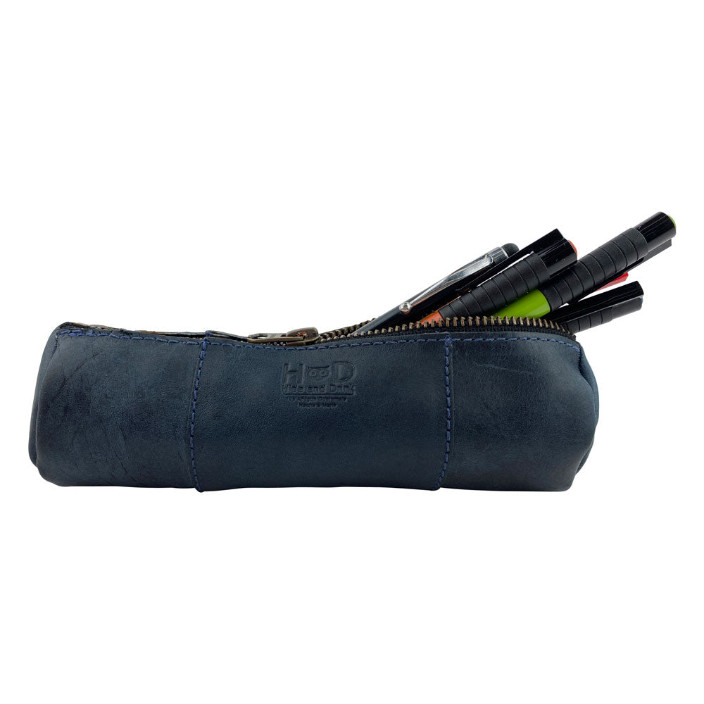 Utility Cylinder Case by Hide & Drink in navy, demonstrating its stylish design and suitable storage for office supplies. This handmade bag emphasizes rustic charm and Full Grain Leather craftsmanship. Cylinder Case, Handmade, Rustic.