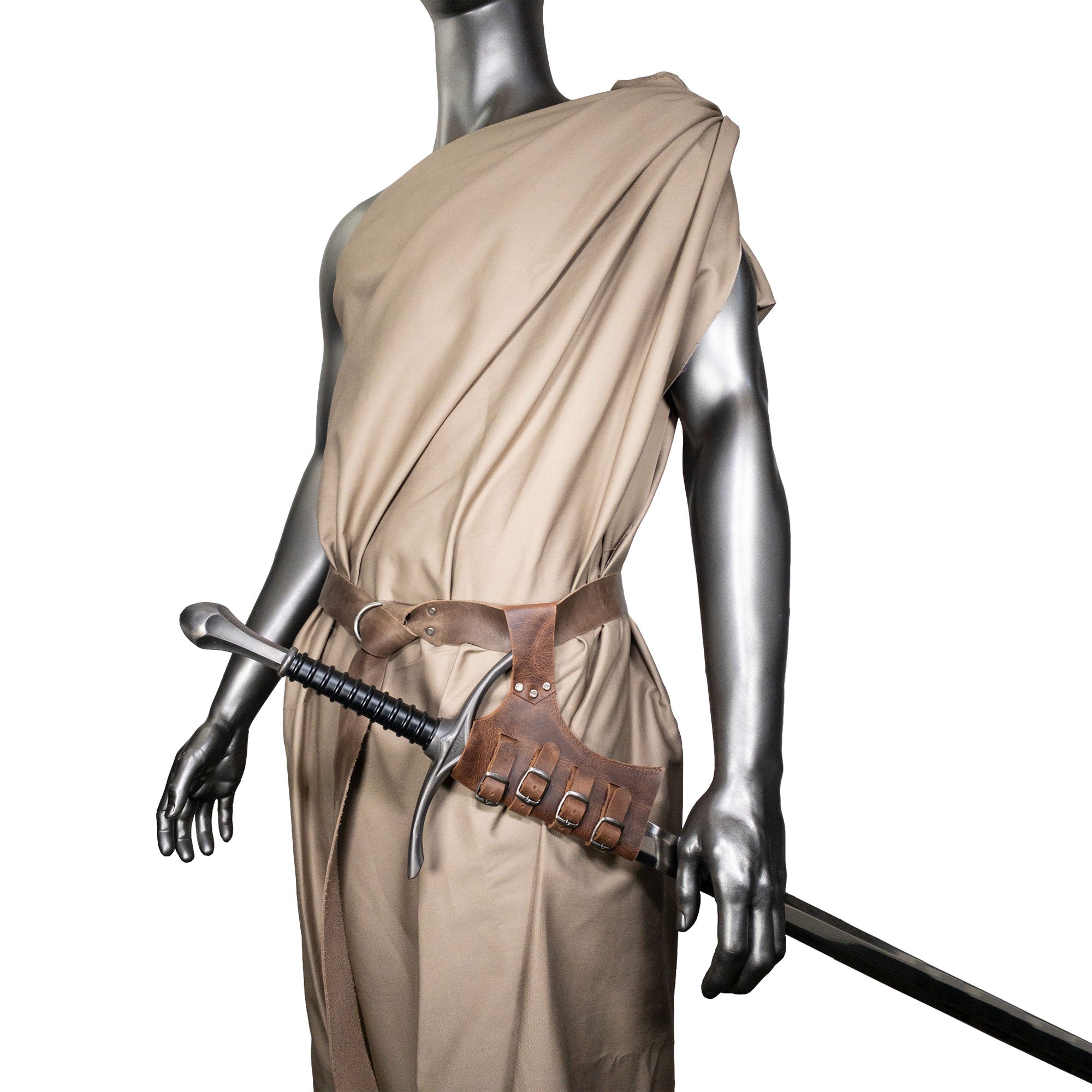 A mannequin wearing the Sword Frog Leather Holder by Hide & Play, elegantly displaying its utility and aesthetic appeal as a costume accessory. Made from durable full grain leather, this artisan product features small batch production techniques, hand cut and fire branded in La Antigua Guatemala and Oaxaca Mexico.