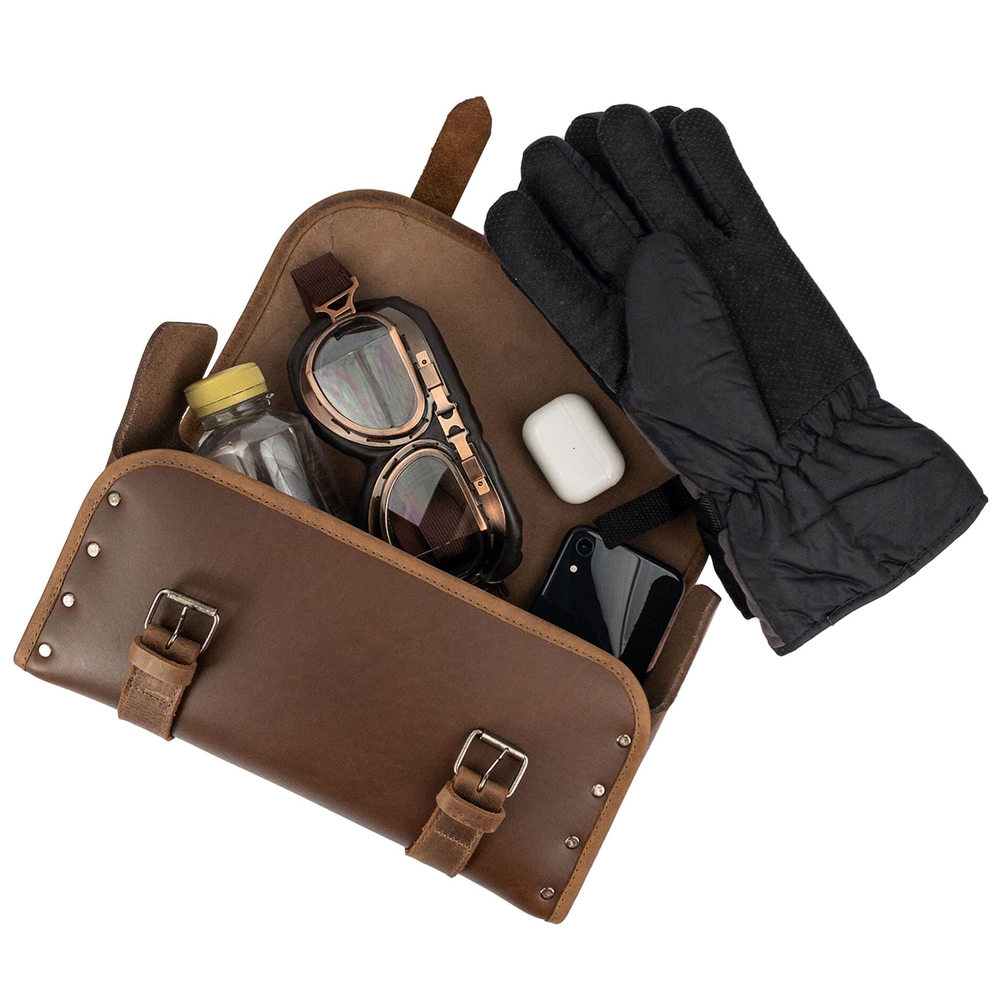 Riveted Bag for Motorcycle by Hide & Ride filled with sunglasses, gloves, and water bottle, highlighting its large capacity. This versatile Motorcycle Riveted Bag is crafted with full grain leather, perfect for bikers, and showcases the quality of handmade craftsmanship in La Antigua Guatemala & Oaxaca Mexico.