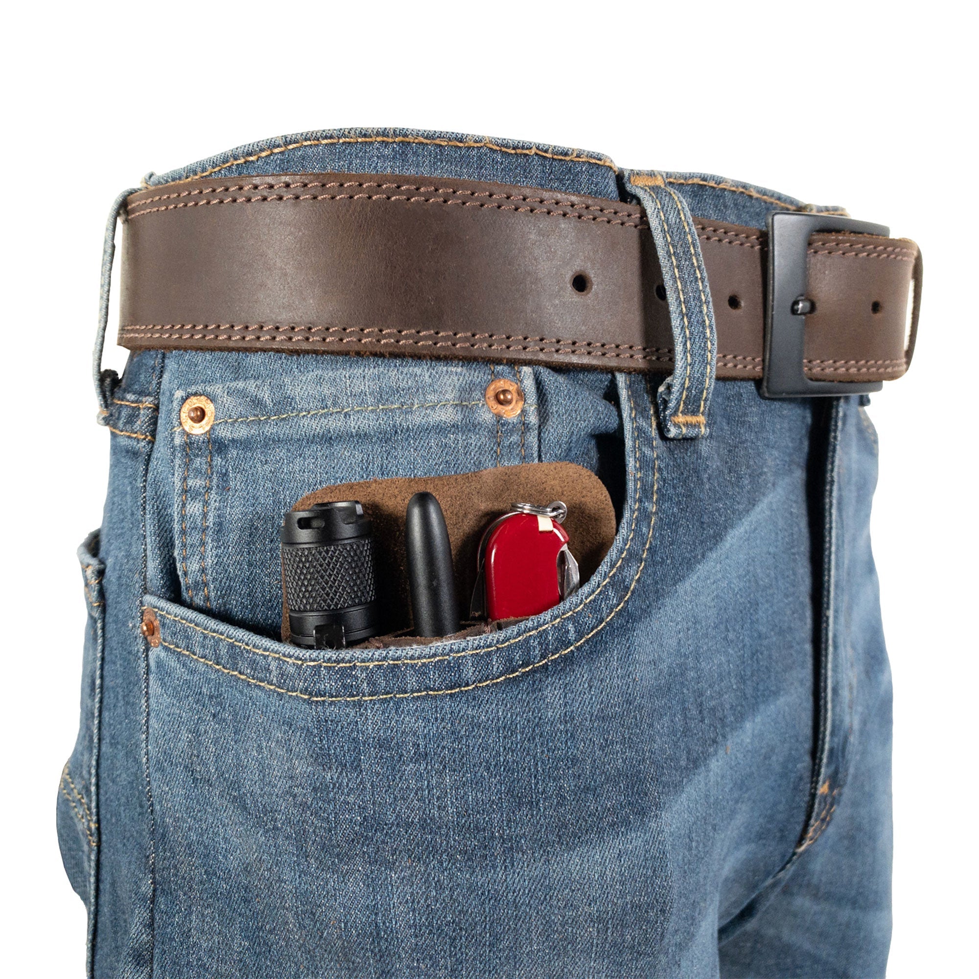 The Compact EDC Tool Holster by Valhalla Gear positioned in a jeans pocket, demonstrating its sleek design. Made from full grain leather with a rustic charm, this pocket case is ideal for carrying tools daily. Handcrafted in La Antigua Guatemala, it embodies small batch production excellence.