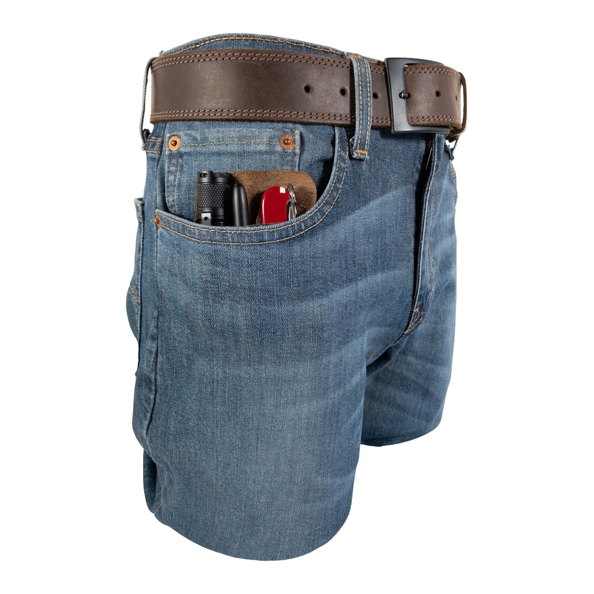 Compact EDC Tool Holster by Valhalla Gear displayed in a shorts pocket, emphasizing its portability. Made from full grain leather, this hand-sewn pocket case is a practical rustic sleeve for tools for everyday use.