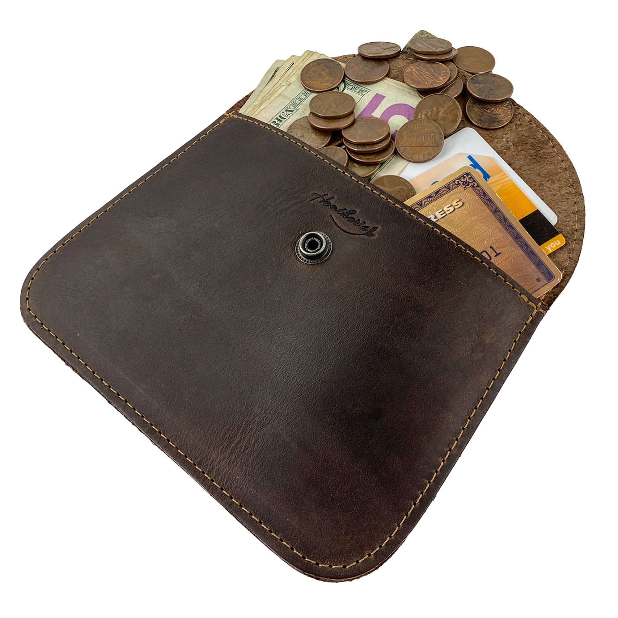 Close-up of Heather's Leaf Card Wallet filled with bills and cards, highlighting its functionality as a leaf-inspired soft coin & cash organizer. This Leaf Card Wallet is also a cable holder and phone & accessories case, handmade in La Antigua Guatemala with attention to artisan craftsmanship.