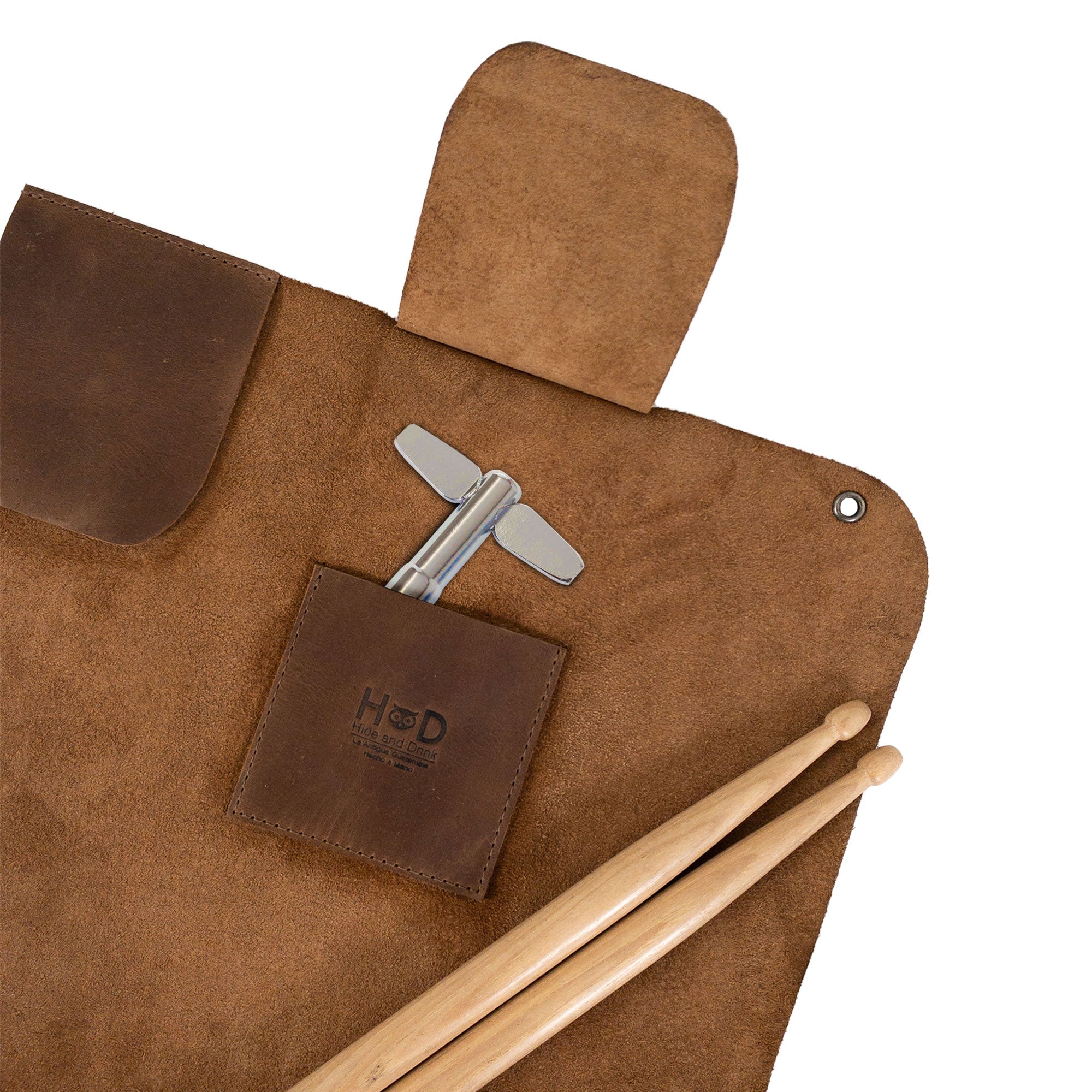 Detail of the Hide & Drink Drumstick Roll with Slot for Drum Key featuring a drum key holder. This product, made from Full Grain Leather, exemplifies artisan craftsmanship through small batch production, hand cut and hand sewn methods, proudly made in La Antigua Guatemala & Oaxaca Mexico.