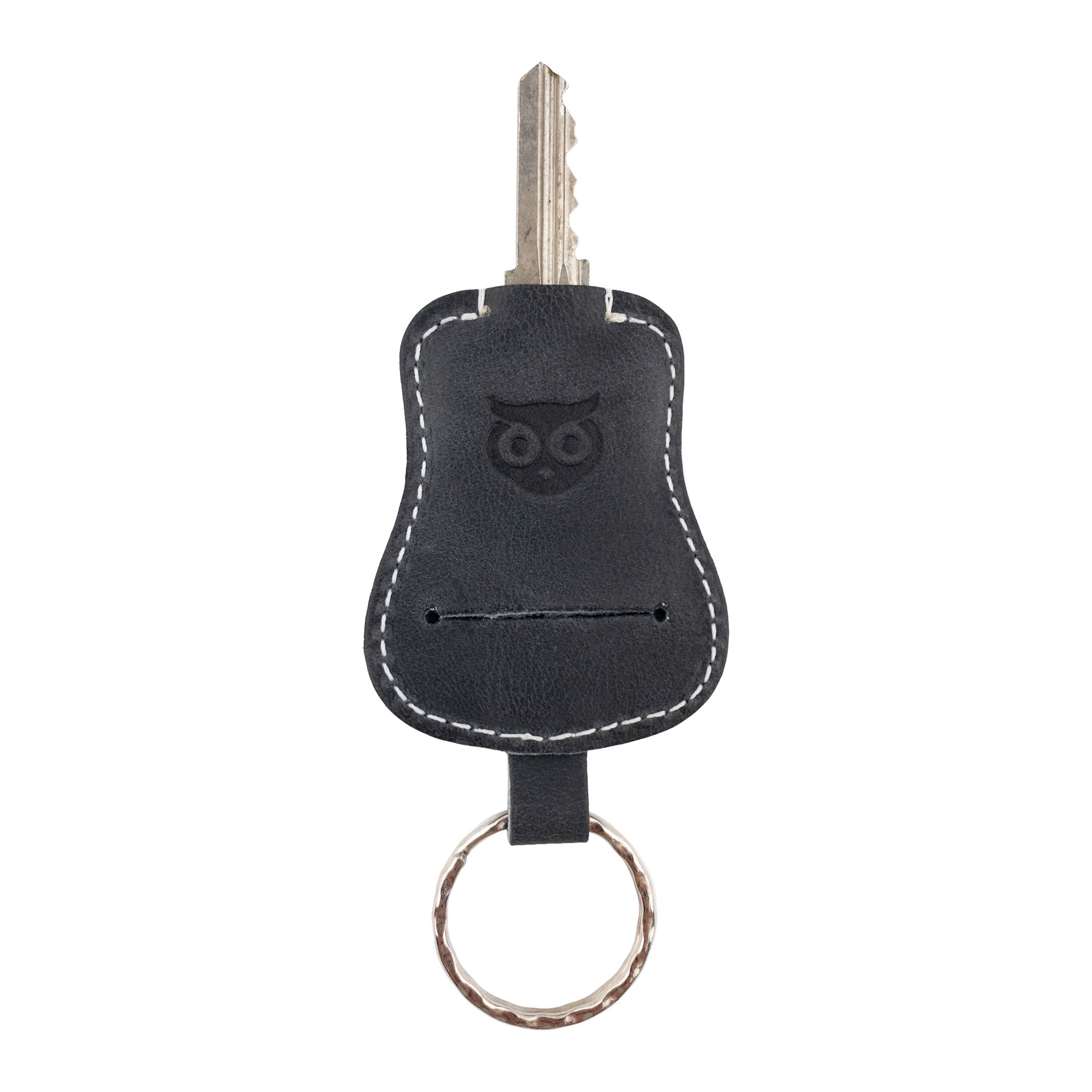Another angle of the black Guitar Keychain by Hide & Drink, demonstrating its useful key holder features. Crafted from high-quality Full Grain Leather, this keyring emphasizes artisan workmanship from small batch productions in La Antigua Guatemala & Oaxaca Mexico.