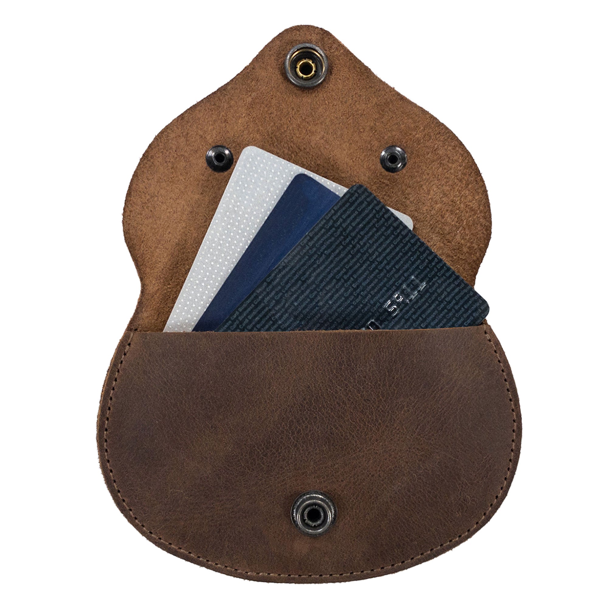 Interior view of the Foxy Head Shape Coin Pouch by Hide & Play, ideal for holding cards and essentials. Crafted from Full Grain Leather, this accessory is a result of small batch production, highlighting its hand cut and hand sewn features, along with fire branding that showcases artisan skill from La Antigua Guatemala & Oaxaca Mexico.