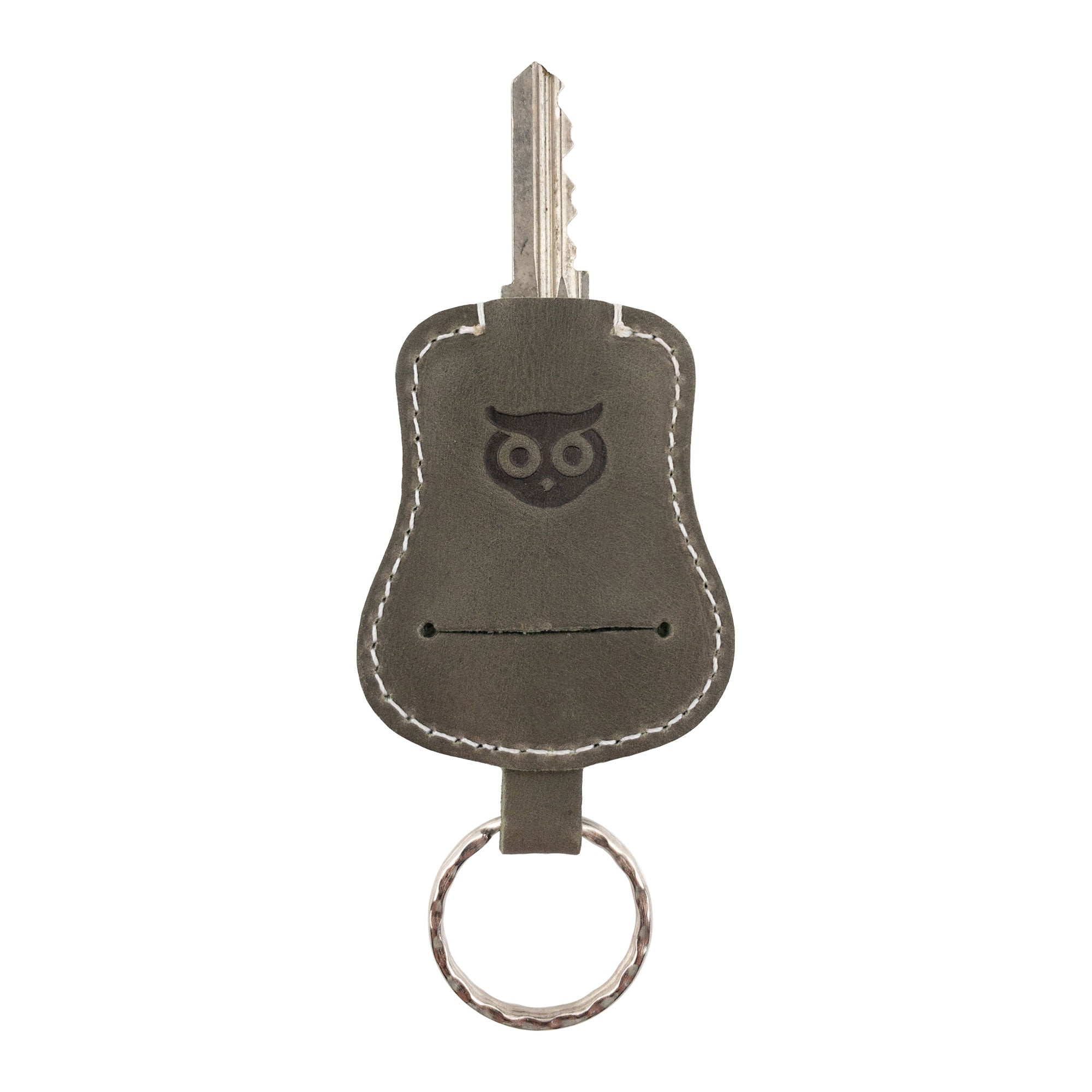 Guitar Keychain by Hide & Drink giving an overview of its impressive design, perfect for carrying keys. Handmade from high-quality Full Grain Leather, this key holder showcases small batch production and artisan craftsmanship from La Antigua Guatemala & Oaxaca Mexico.