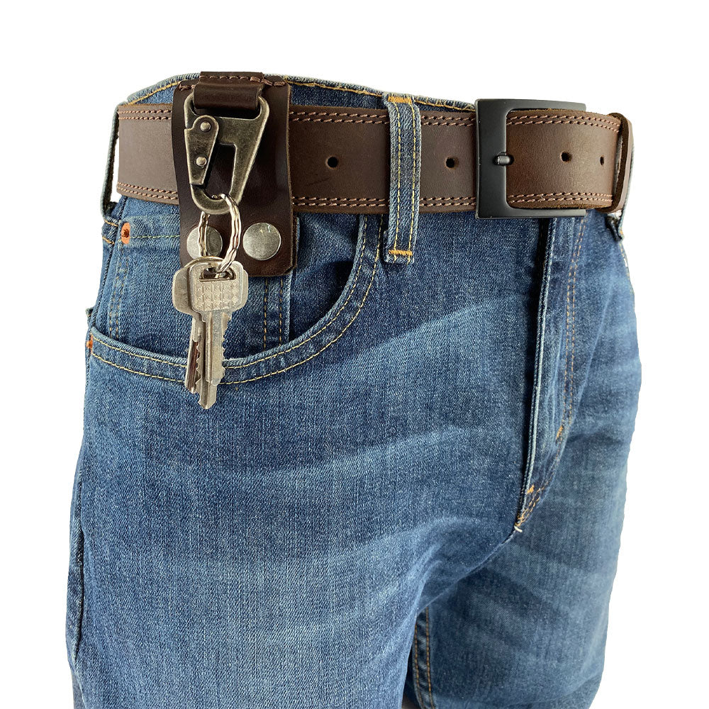 Close-up of Belt Keychain Holder Hook by Hide & Drink, highlighting its metal clip and thick full grain leather, perfect for a secure belt clip key chain holder hook. This artisan-crafted piece is handmade in La Antigua Guatemala & Oaxaca Mexico, showcasing small batch production.