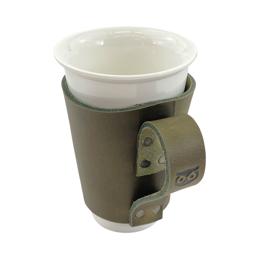 Pint Sleeve with Handle by Hide & Drink, showcasing its artisanal craftsmanship. Made from high-quality Full Grain Leather, this Hand Cut and Hand Sewn piece is perfect for any bar or pub.