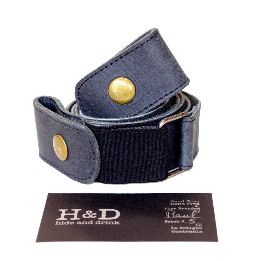 Hide & Drink's No Buckle Belt elegantly coiled to show its sturdy structure and handcrafted quality. This buckle-free leather belt is 1.5 inches wide, providing a comfortable, adjustable fit. Created from full grain leather, it reflects artisan craftsmanship typical of small batch production from La Antigua Guatemala & Oaxaca Mexico.