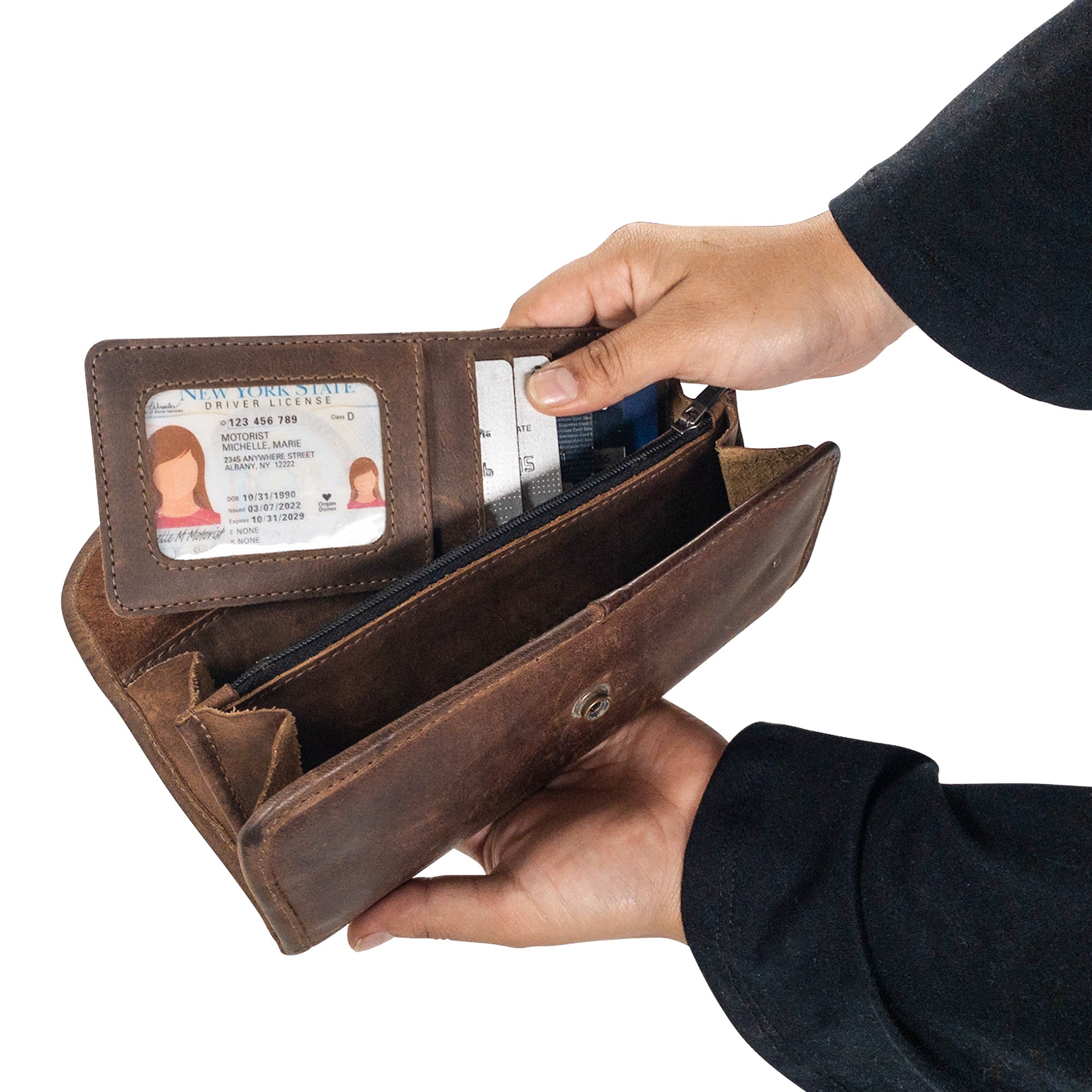 A hand holding Heather's Vertical Cards & ID Organizer, demonstrating its usability and style, crafted from Full Grain Leather, a hallmark of StockyardX's commitment to Small Batch Production and artisan techniques.