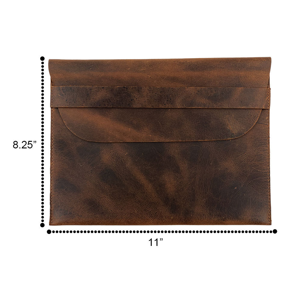 Dimensions of the Tablet Slim Case by Hide & Drink displayed alongside its measurements. This sleeve is tailored for iPad 2 & iPad 3 and showcases top-quality full grain leather craftsmanship. Each case is handmade with a focus on small batch production and artisan techniques, including fire branding to ensure its uniqueness, all made in La Antigua Guatemala & Oaxaca Mexico.