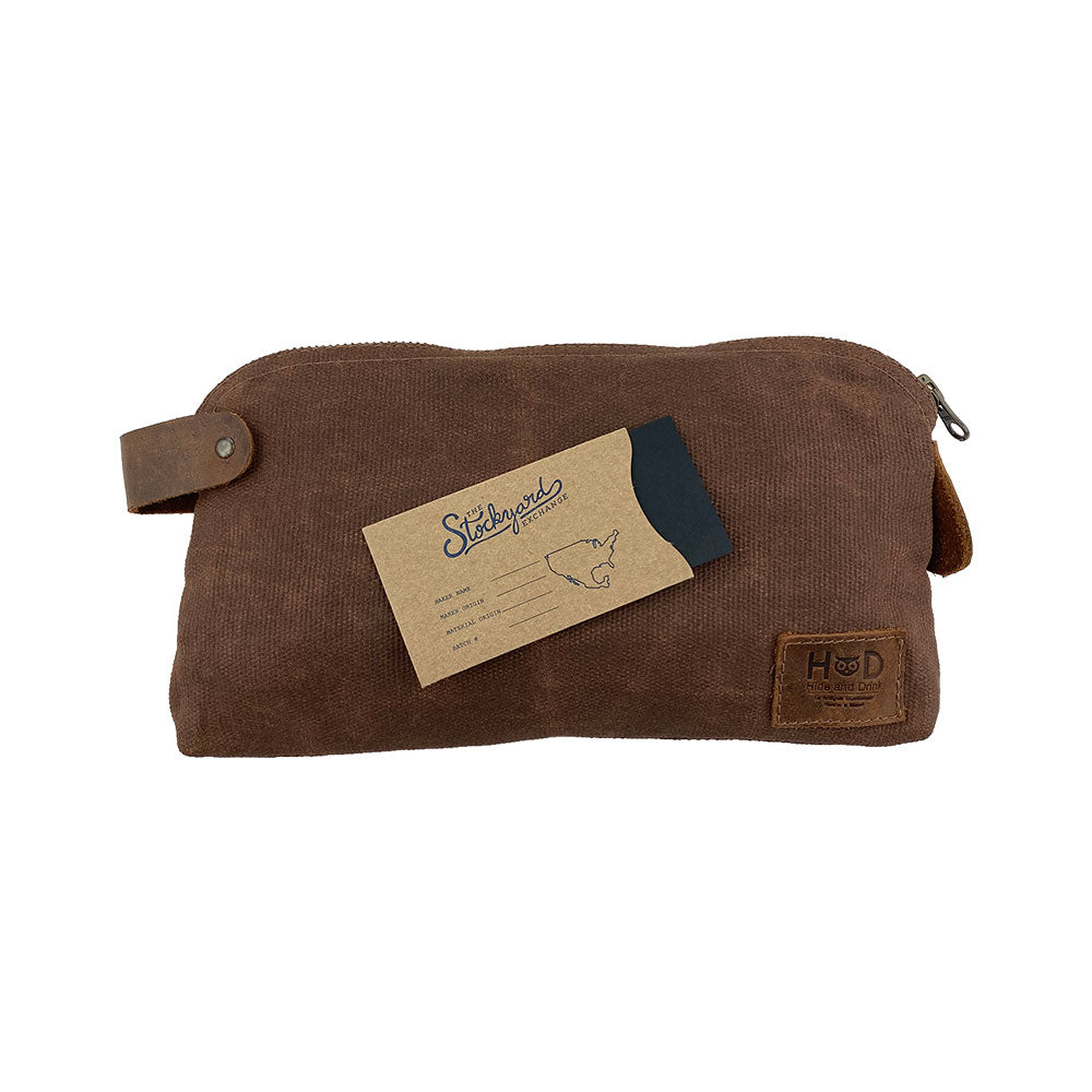 Dopp Kit Utility Bag by Hide & Drink demonstrating its versatile design and practical usage. This artisan-crafted Dopp Kit Utility Bag made from full grain leather showcases artisan methods like hand cut and hand sewn craftsmanship ensuring quality, handmade in La Antigua Guatemala & Oaxaca Mexico.