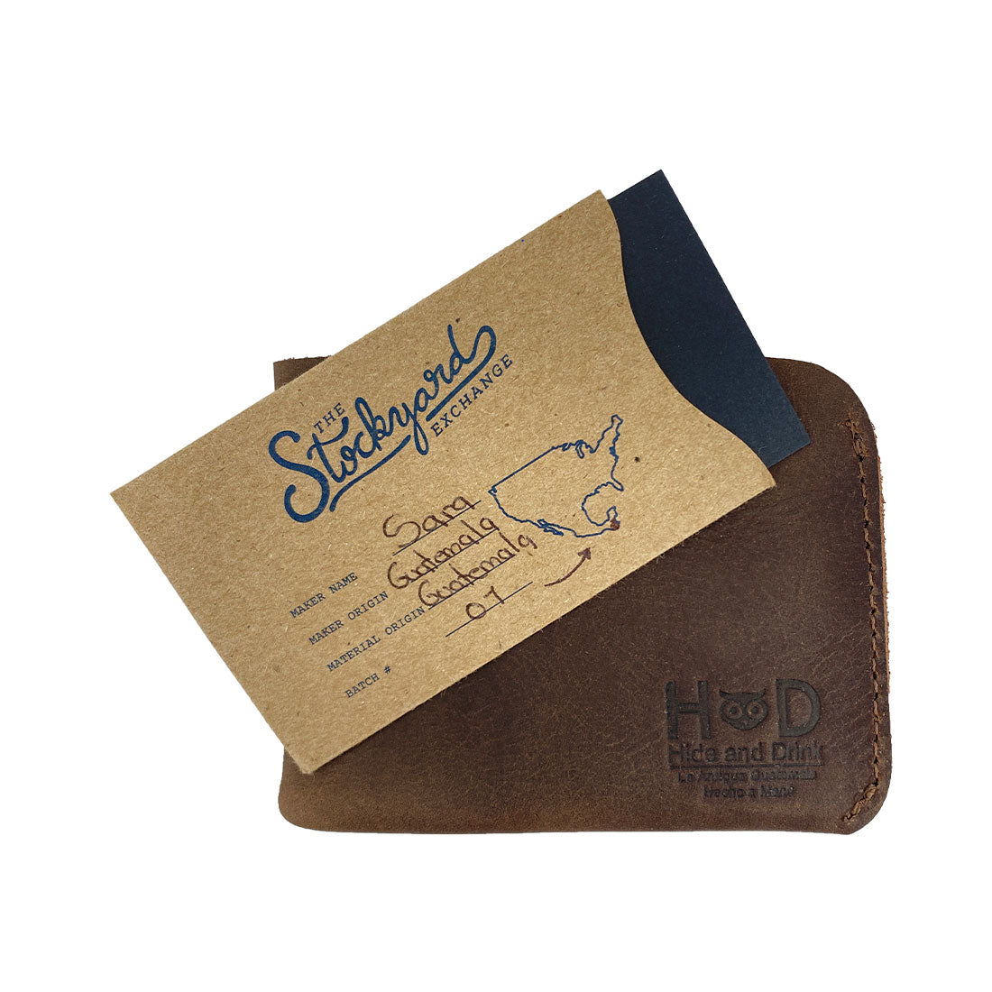 The Hide & Drink Minimal Wallet presented with a business card, highlighting its versatility as a Full Grain Leather Classic Slimfold Wallet. This Card Organizer Holder doubles as a stylish Travel Accessory, Hand Cut and Hand Sewn in Small Batch Production by artisans from La Antigua Guatemala & Oaxaca Mexico.