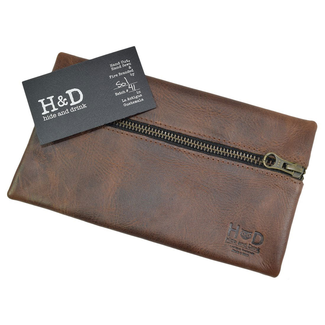 Hide & Drink Utility Cord Pouch presented with branding, highlighting its unique features. This artisan pouch serves as a versatile utility & charger case for MacBook, iPad & Laptop, making it a great cable organizer while showcasing its handmade roots in La Antigua Guatemala & Oaxaca Mexico.
