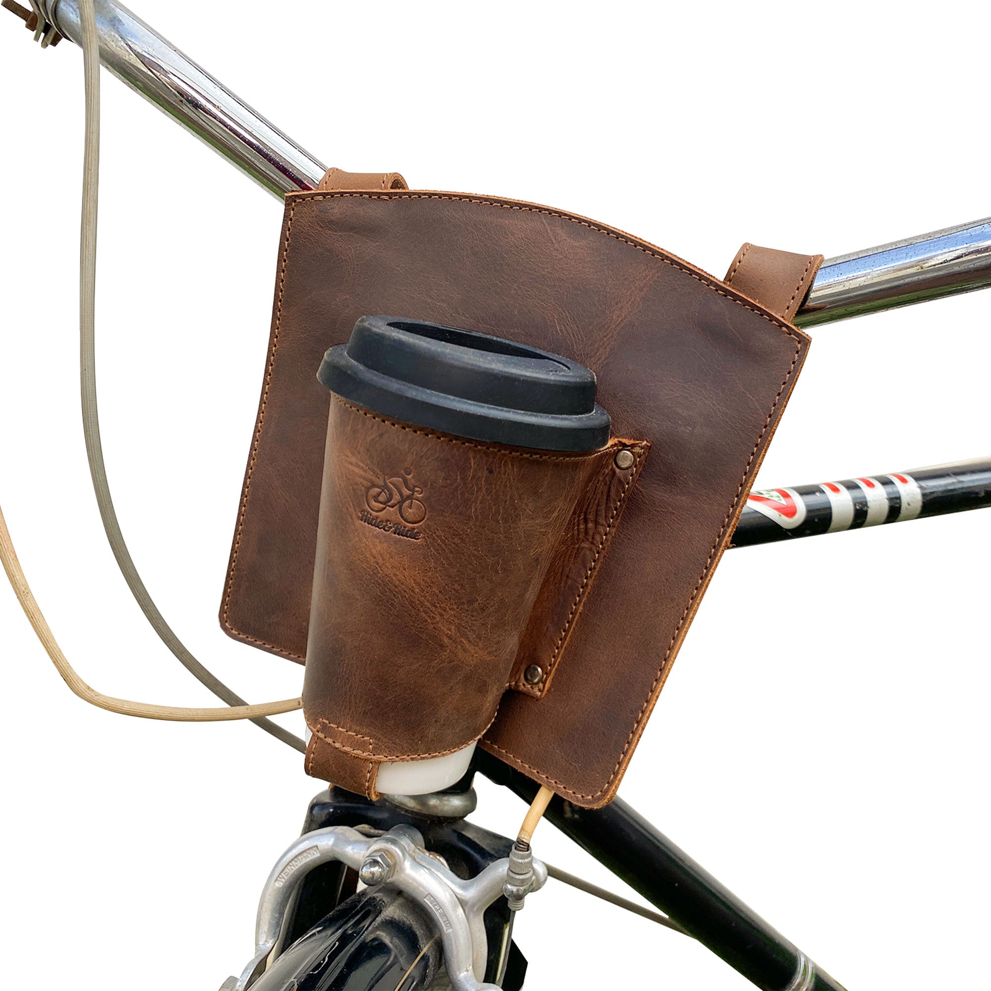 Bike Handlebar Cup Holder by Hide & Ride attached to a bicycle, showcasing its stylish integration for cyclists looking for convenience. Bike Handlebar Cup Holder Handmade from Full Grain Leather - Beverage Pouch for Commuters, Minimalist Bikers, Cyclers, Urban Nomad, Full Grain Leather, StockyardX, Small Batch Production, Hand Cut, Hand Sewn, Fire Branded, Artisan, Handmade in La Antigua Guatemala & Oaxaca Mexico.