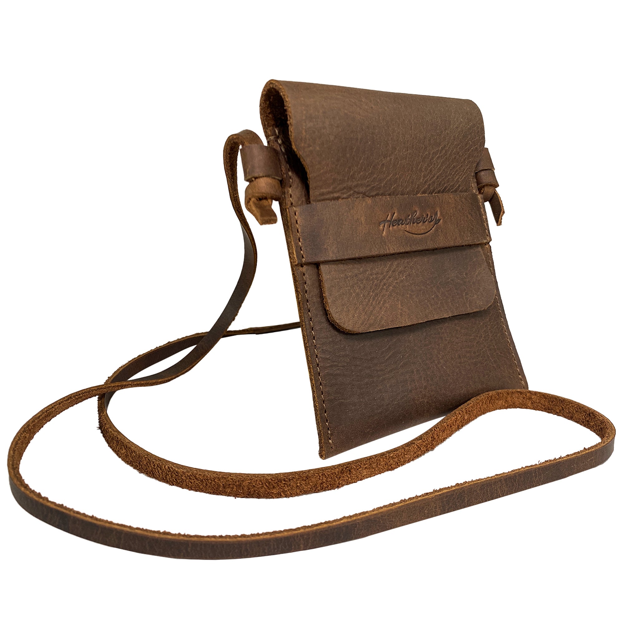 Mini Travel Bag by Heather's with a strap, demonstrating its practicality for daily use. This Mini Travel Bag Handmade from Full Grain Leather is a classic organizer, coin pouch, and storage case for ID, credit cards, and cash. StockyardX, Small Batch Production, Hand Cut, Hand Sewn, Fire Branded, Artisan, Handmade in La Antigua Guatemala & Oaxaca Mexico.