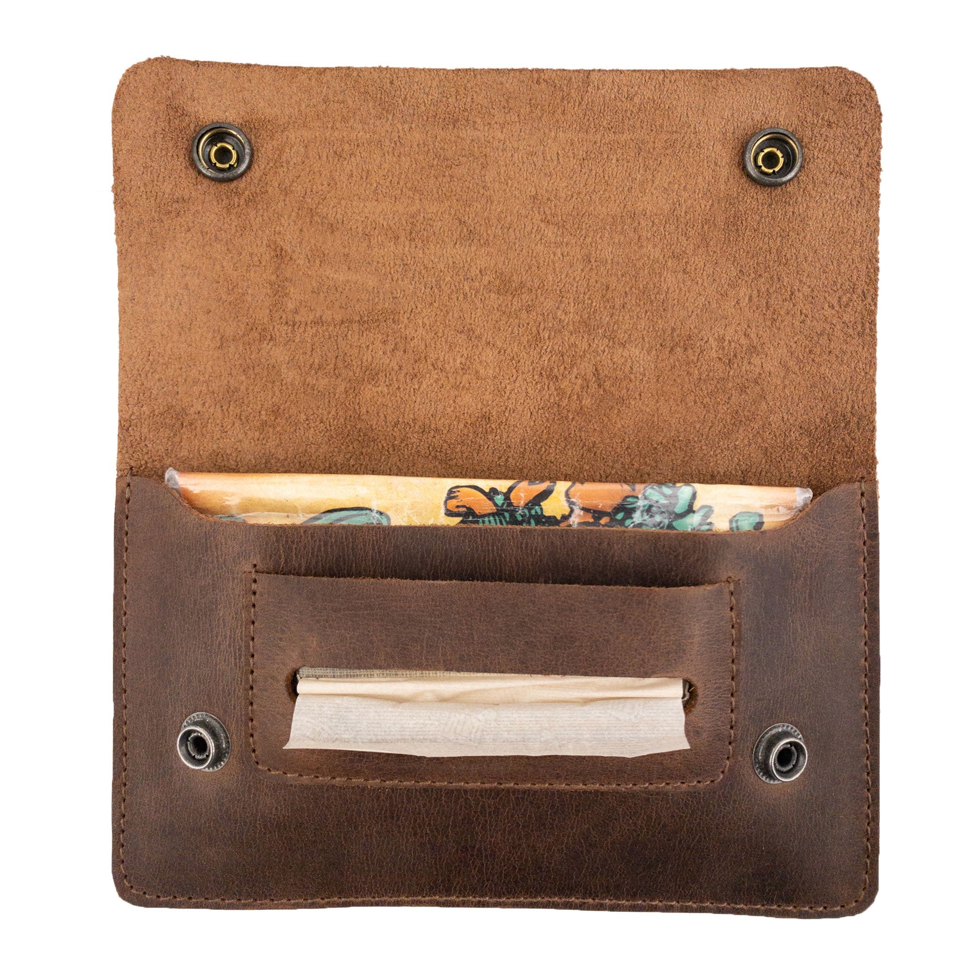 Showcasing the Double Snap Tobacco Pouch by Hide & Drink, this image highlights a classic style flat tobacco pouch made from full grain leather. Ideal for travel accessories, this smoking case is hand cut and hand sewn with a fire branded artisan touch. Handcrafted in La Antigua Guatemala and Oaxaca Mexico, it represents small batch production at its finest.