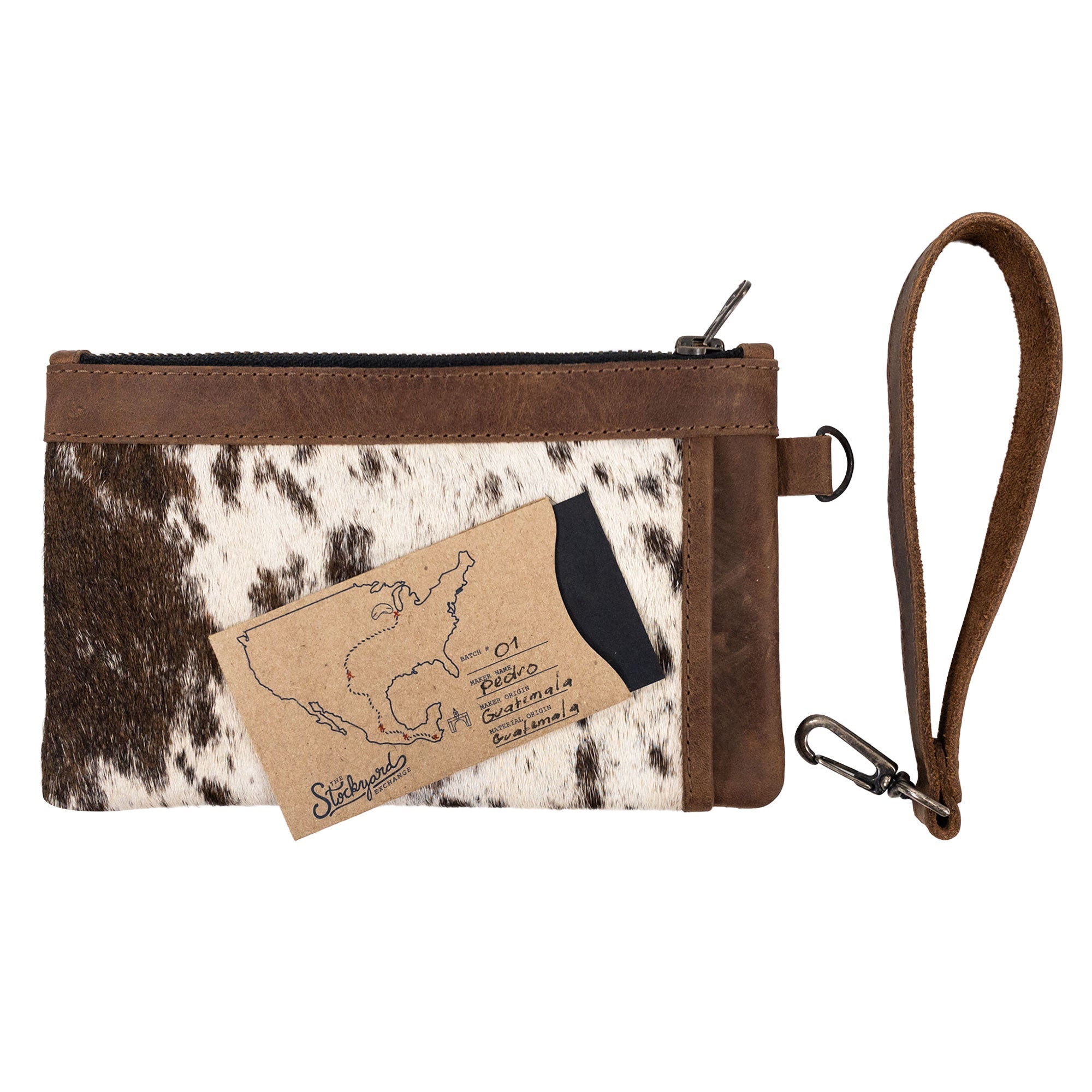 Wristlet Clutch Bag by Western Leather Works showing credit card placement alongside an artisan touch. This rectangular wristlet clutch handbag features a Western style and full grain leather, showcasing small batch production practices. Handmade in La Antigua Guatemala.