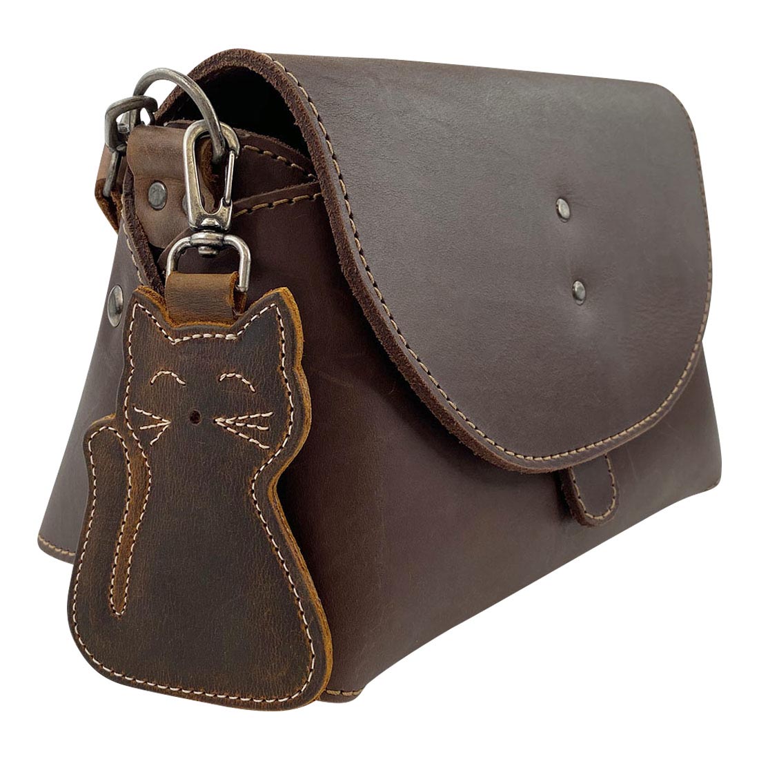 Stylish Cat Keychain by Taco Dog attached to a chic purse, featuring a beautiful rustic look and adorable design. This functional, lightweight key holder made from full grain leather is perfect for cat lovers, highlighting artisan craftsmanship from small batch production in La Antigua Guatemala.