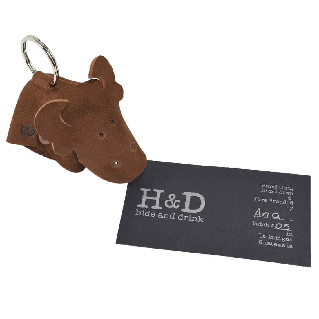 Artisan Full Grain Leather Animal Key Chain by Hide & Drink, showcasing a handcrafted cow design. This beautiful Critter Keychain doubles as a fob charm and an animal key holder charm pendant, emphasizing the small batch production in La Antigua Guatemala.