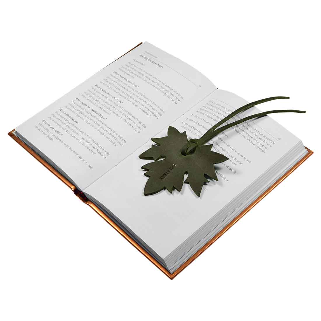 Another view of the Autumn Bookmark (3 pack) by Hide & Drink, demonstrating its charming maple leaf shape and rich texture. Ideal for book lovers, this full grain leather bookmark serves as a perfect gift and practical accessory for those who enjoy reading. Autumn Bookmark (3 Pack), Bookworm Gifts, Cute Accessories, Small Batch Production, Hand Cut, Hand Sewn, Fire Branded.