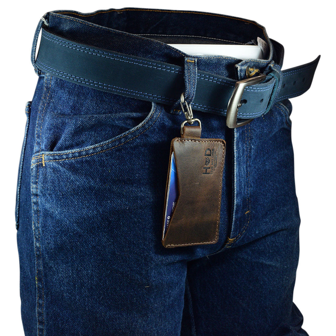 Lifestyle shot of Hide & Drink's Leather Card & Key Holder clipped to a belt loop, perfect for everyday use. This organizer can hold up to 4 cards, making it an excellent Keychain Organizer. Made from Full Grain Leather, it’s an artisan-crafted accessory that showcases hand cut and hand sewn techniques, representing small batch production proudly from La Antigua Guatemala & Oaxaca Mexico.