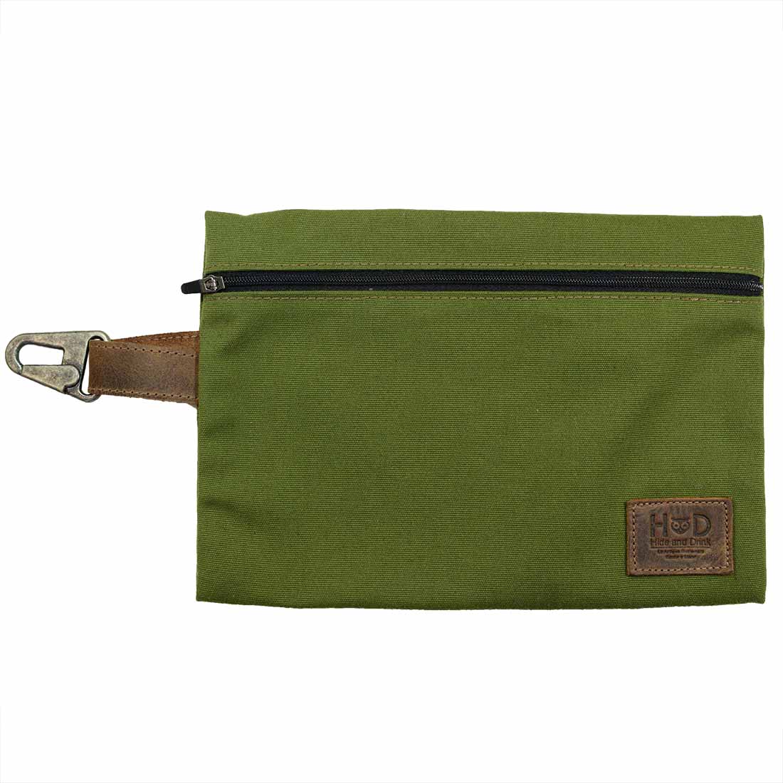 Hide & Drink Outdoor Pouch in olive green, showcasing its Water Resistant Canvas construction. This stylish Camping Pouch acts as a versatile storage case and utility bag for outdoor accessories, made with durable Full Grain Leather and designed through small batch production in La Antigua Guatemala & Oaxaca Mexico.
