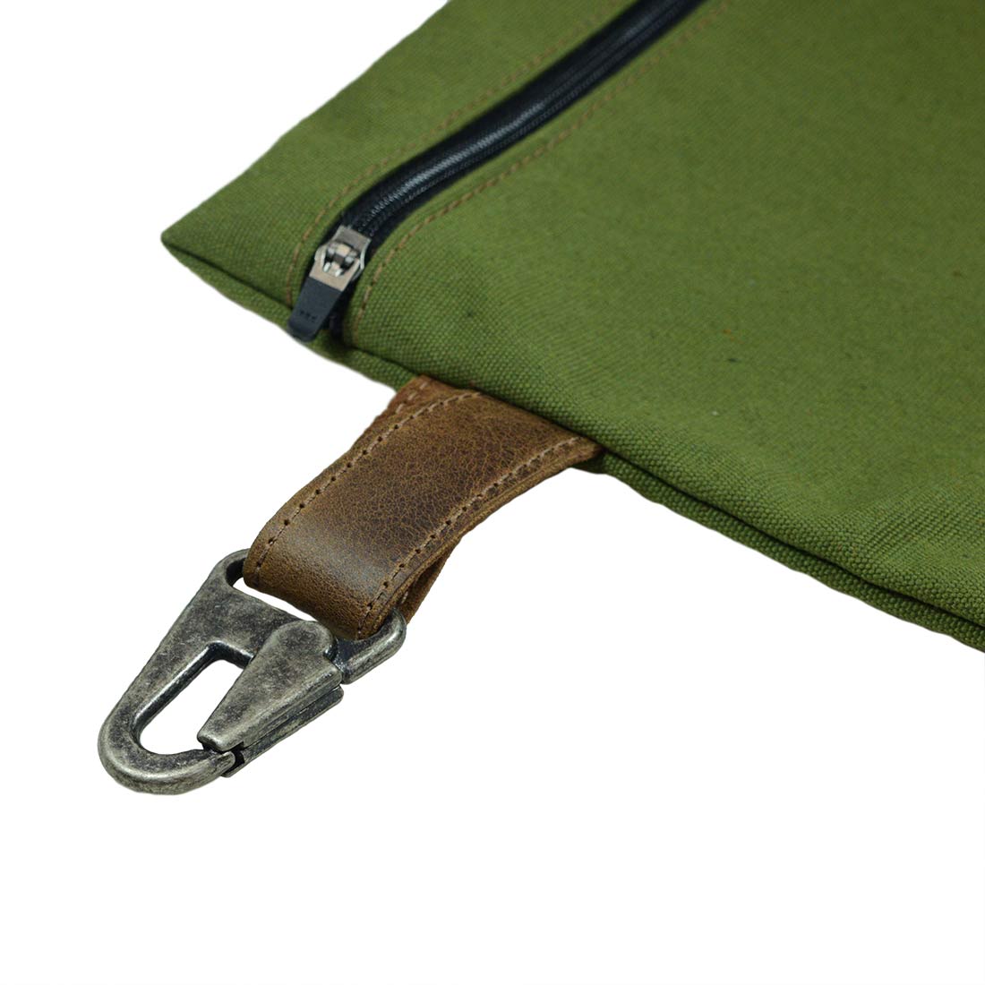 Close-up of the strap and zipper of Hide & Drink Outdoor Pouch, a Water Resistant Canvas Camping Pouch perfect for outdoor storage. The practical design, featuring Full Grain Leather, reflects its utility as a storage case and utility bag for outdoor accessories, handcrafted in small batches in La Antigua Guatemala & Oaxaca Mexico.