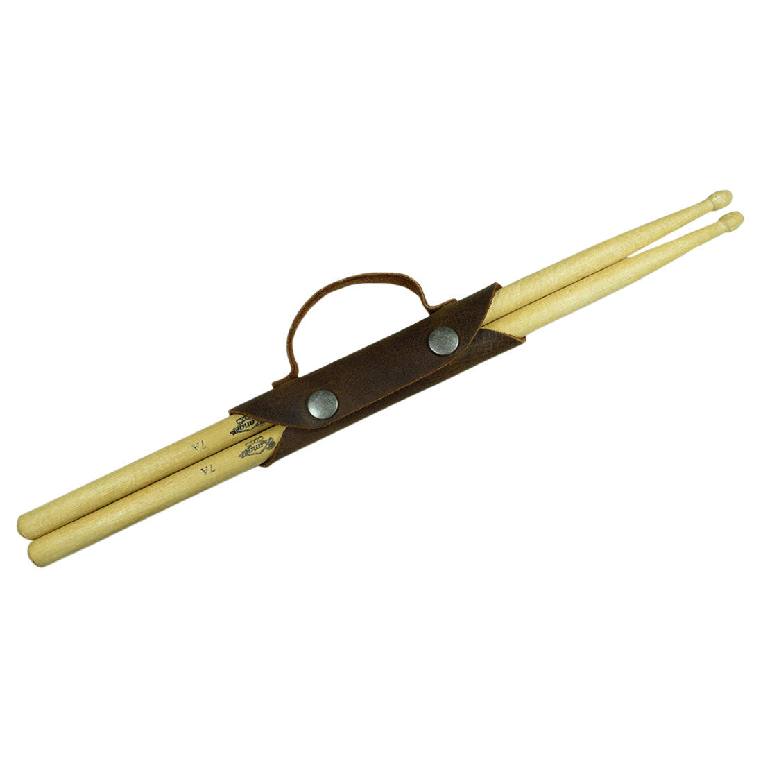 The Hide & Drink Drumstick Holder featured with two classic Drumsticks, demonstrating its practical use as an Organizer Case. Made from durable Full Grain Leather, this Drummer Essential emphasizes hand-crafted quality through Small Batch Production techniques, reflecting the Artisan skills of local makers in La Antigua Guatemala & Oaxaca Mexico.