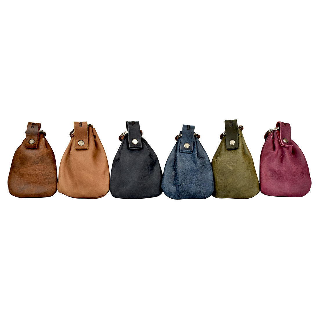 A collection of Mini Medieval Pouch Keychains by Hide & Drink showcasing various colors and textures. Each tiny bag with keyring is made from high-quality full grain leather, ideal for organizing coins. These handcrafted coin pouches highlight artisan skills with small batch production and hand-cut, hand-sewn details. Perfect for those who appreciate unique and durable accessories, all handmade in La Antigua Guatemala & Oaxaca Mexico.