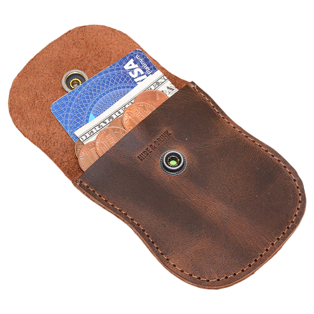 An open Curvy Coin Pouch by Hide & Drink with coins and a card inside, highlighting its practicality as a rustic bag and artisan accessory, beautifully hand cut and sewn.