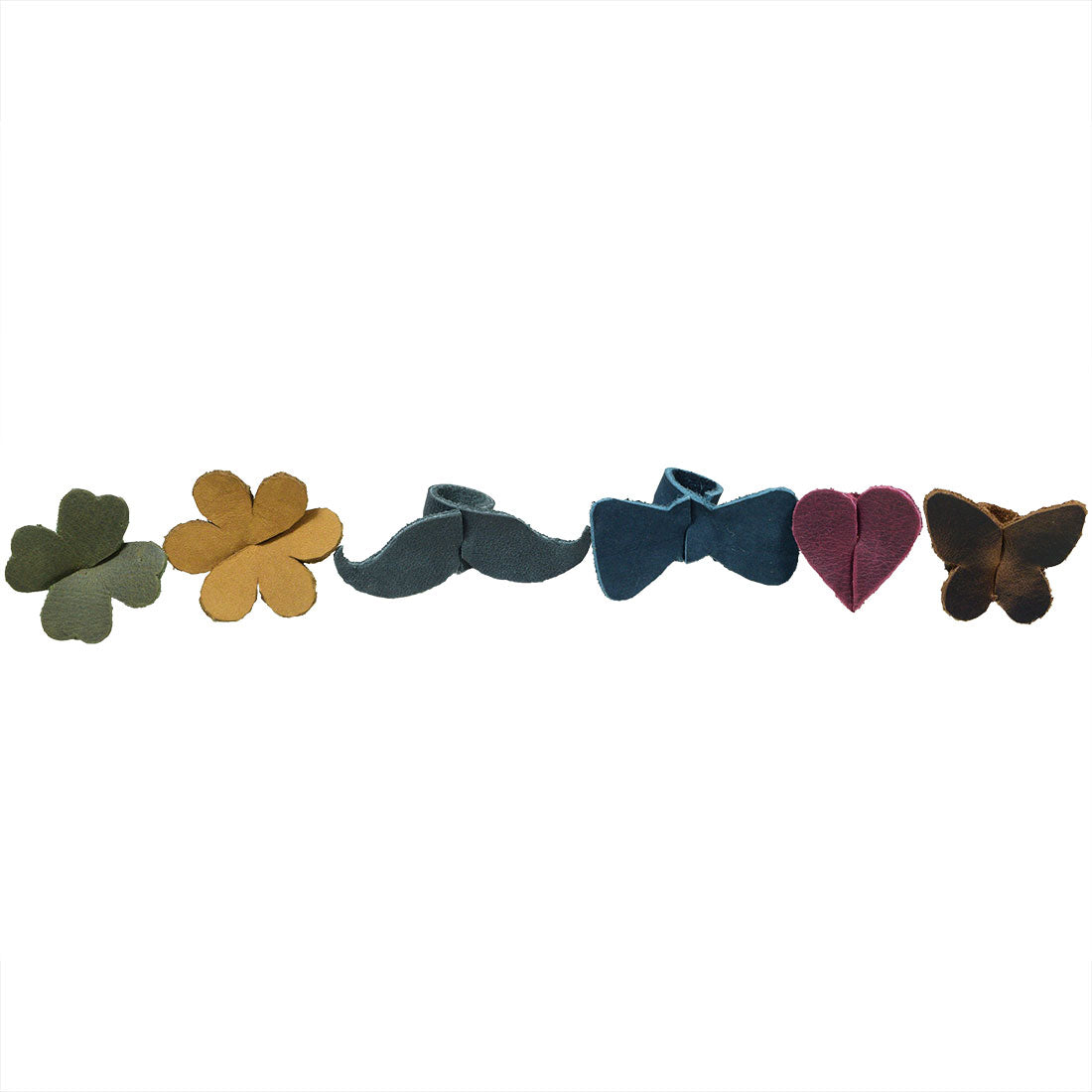 Complete set of Drink Tags (6 Pieces) by Hide & Drink laid out, featuring designs of clover, mustache, bow, heart, and butterfly. These beautiful Drink Markers serve as glass identification tools and elegant napkin rings, enhancing any party setting. Made from durable Full Grain Leather through artisan small batch production, each piece is hand cut and sewn in La Antigua Guatemala & Oaxaca Mexico.
