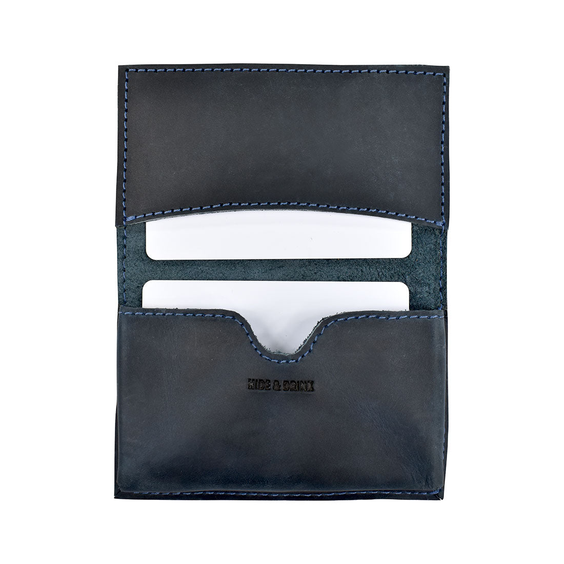 Hide & Drink's Vintage Card Holder displaying cash and business cards, exemplifying functionality in style. Crafted from full grain leather, this wallet reflects small batch production artistry from La Antigua Guatemala & Oaxaca Mexico.