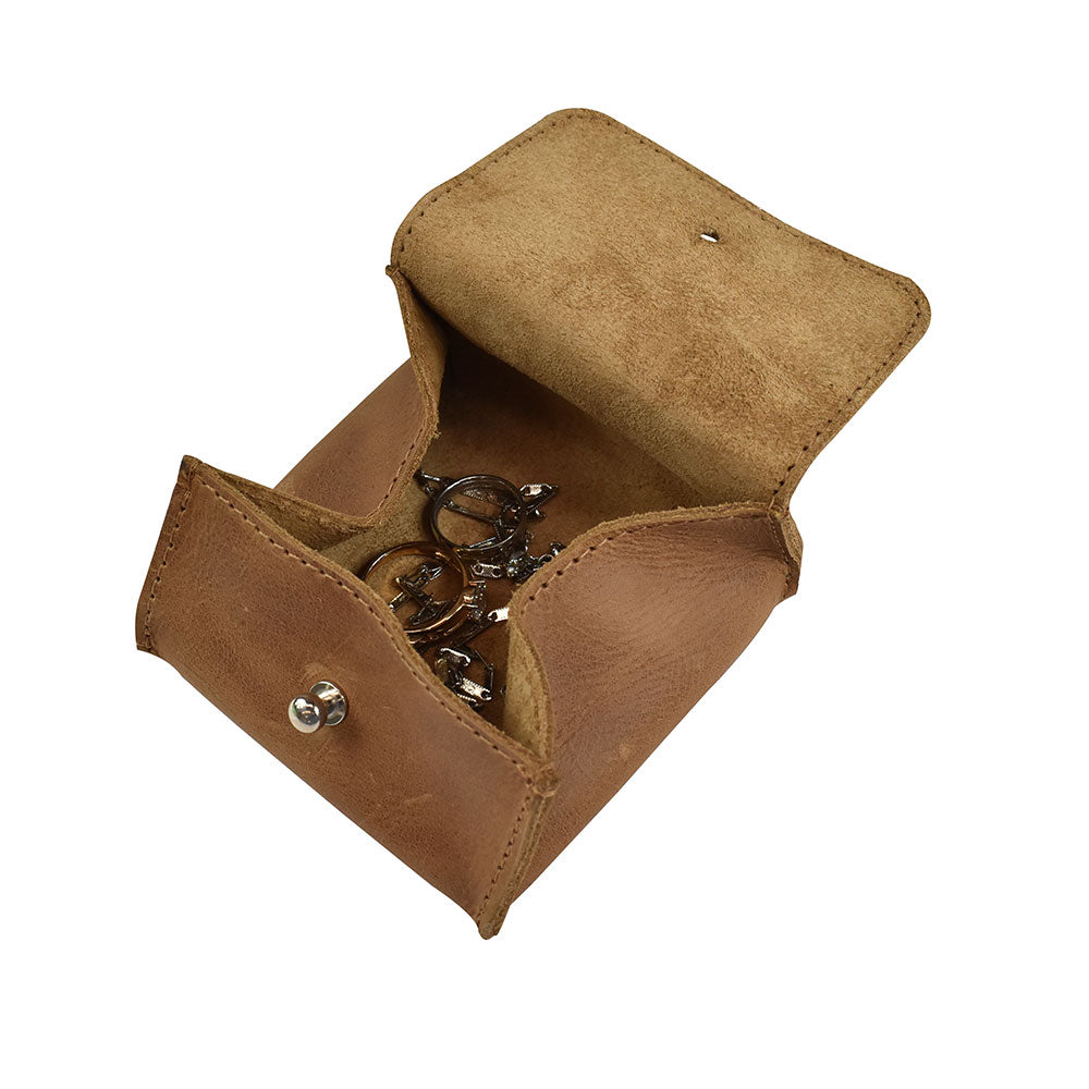 Open Hide & Drink Jewelry Pouch featuring its storage potential for rings and fragile items, made with full grain leather. A perfect handmade gift for wedding parties, showcasing artisan skills and sustainable practices.