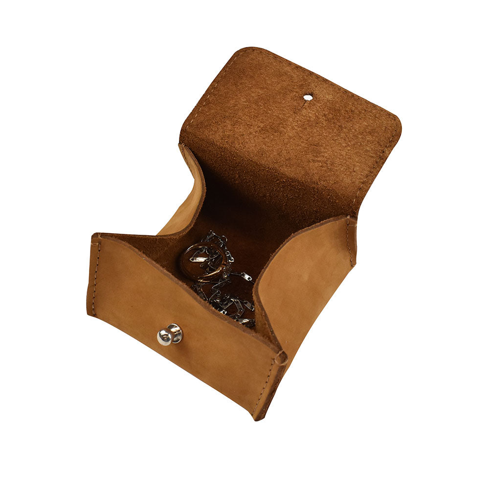 Open view of a Hide & Drink Jewelry Pouch demonstrating its elegant interior for storing rings and precious articles. This artisan-crafted pouch in top-quality leather is perfect for wedding gifts.