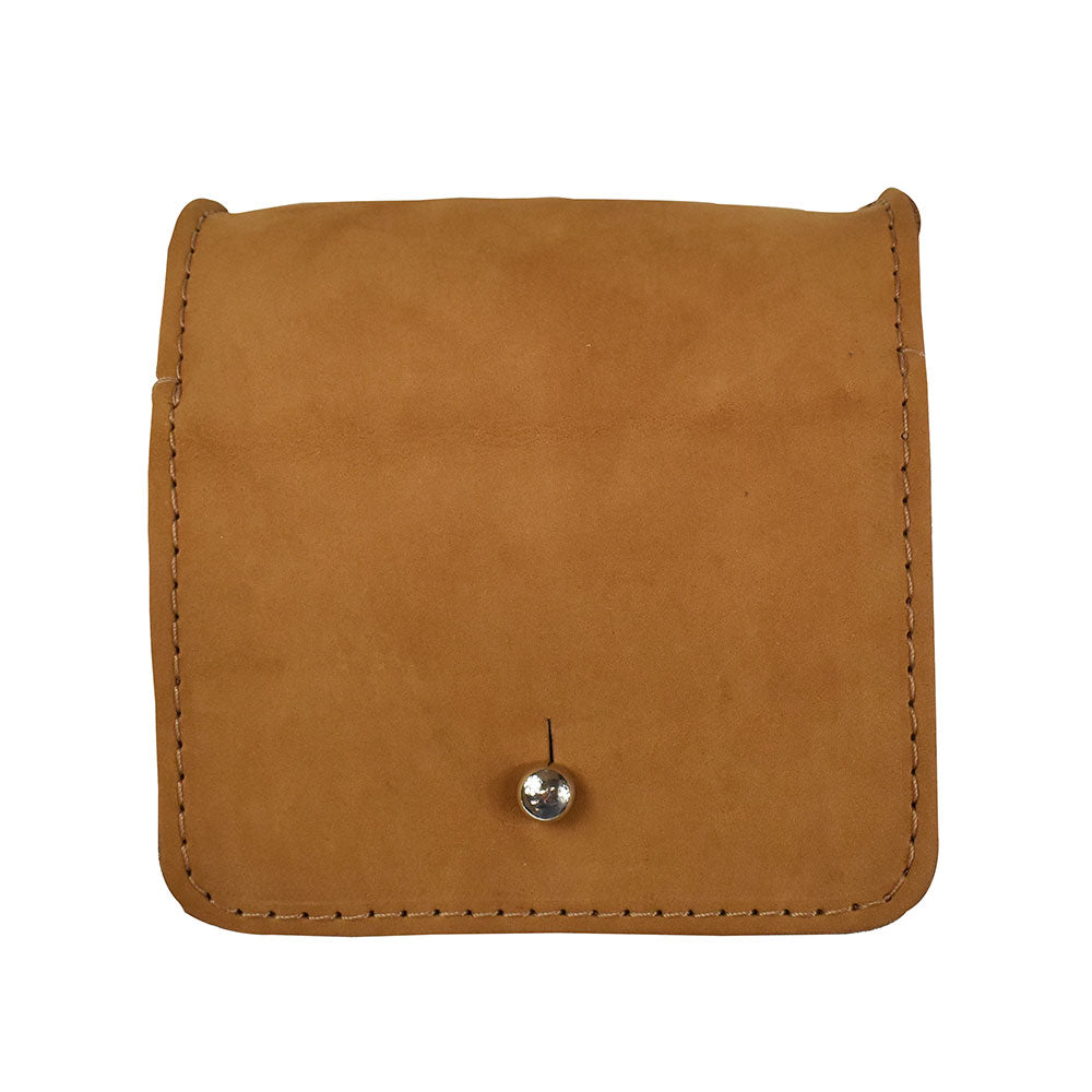 Close-up of a Hide & Drink Jewelry Pouch, showcasing its artisanship and rich full grain leather. This storage solution serves not only as jewelry organization but also as a unique gift for wedding celebrations.
