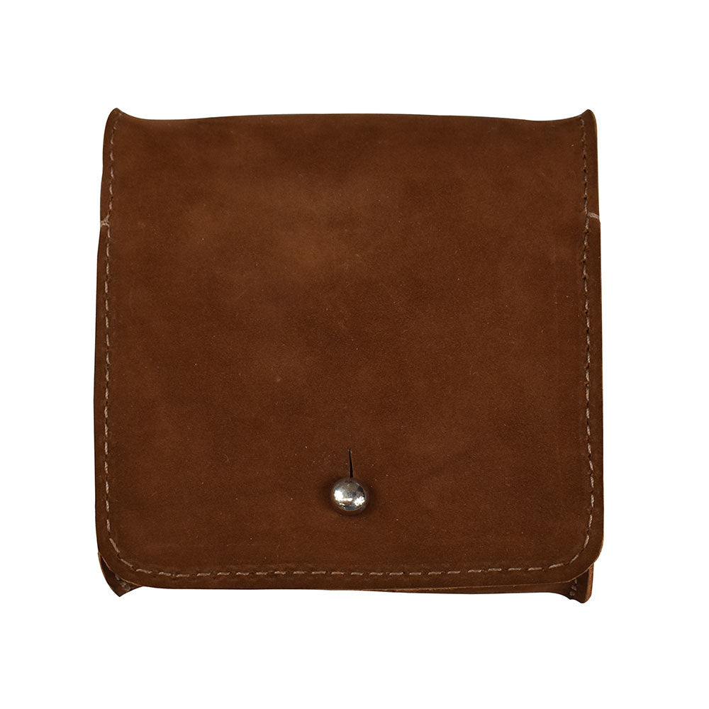 Closed view of a Hide & Drink Jewelry Pouch made from sustainable full grain leather, perfect for keeping rings and precious articles safe. Great for wedding gifts, this pouch highlights the brand's artisan craftsmanship from La Antigua Guatemala.