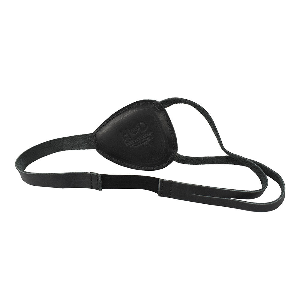 Front view of the Hide & Drink Eye Patch, featuring its elegant design in Full Grain Leather. This artisan product is perfect for those seeking unique Halloween Pirate Costumes and Carnival Masks, embodying small batch production and intricate craftsmanship, making it an exceptional cosplay accessory, handmade in La Antigua Guatemala & Oaxaca Mexico.
