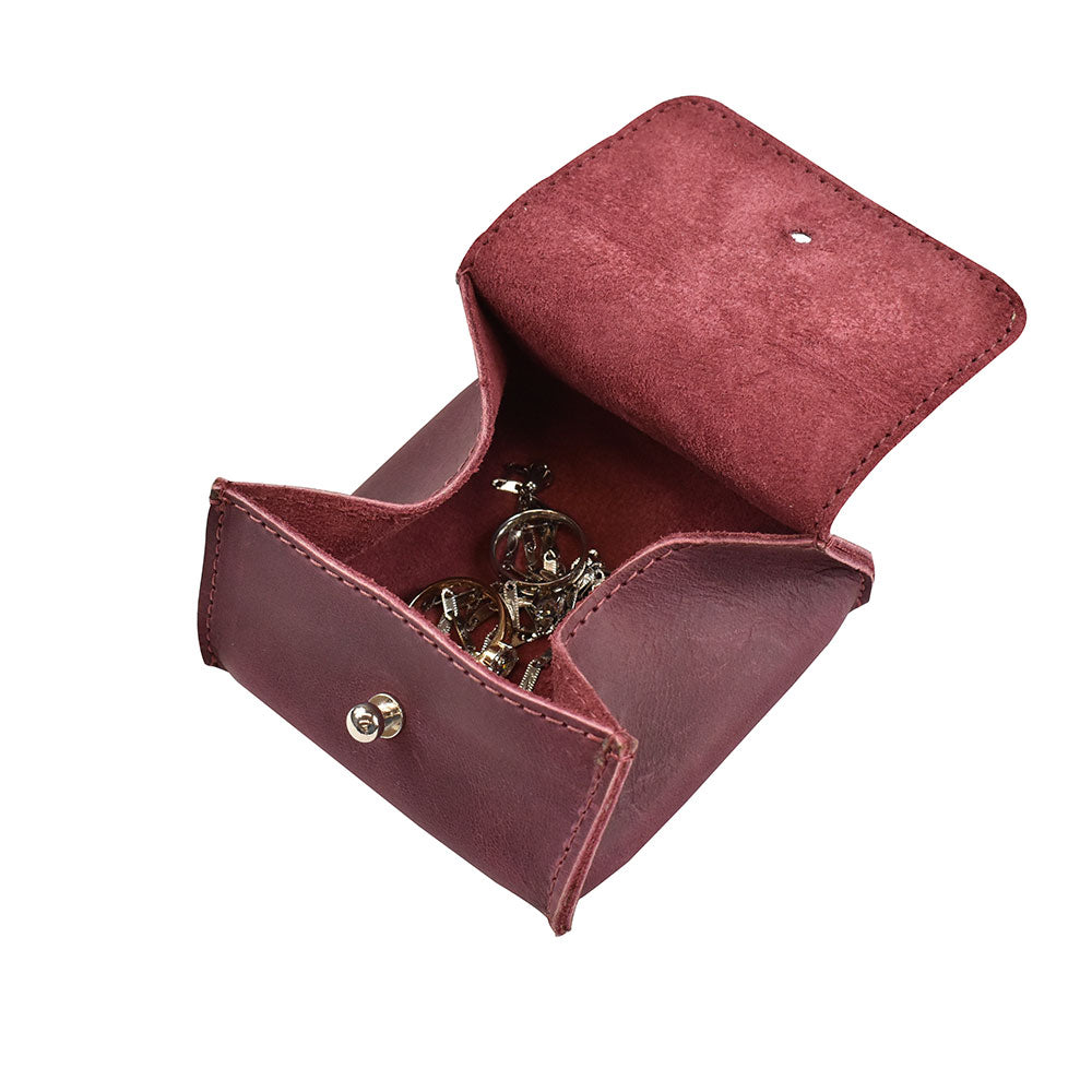 Interior of a Hide & Drink Jewelry Pouch showcasing its spacious architectural design, perfect for storing rings and precious jewelry. Artisan craftsmanship makes it a desirable gift.