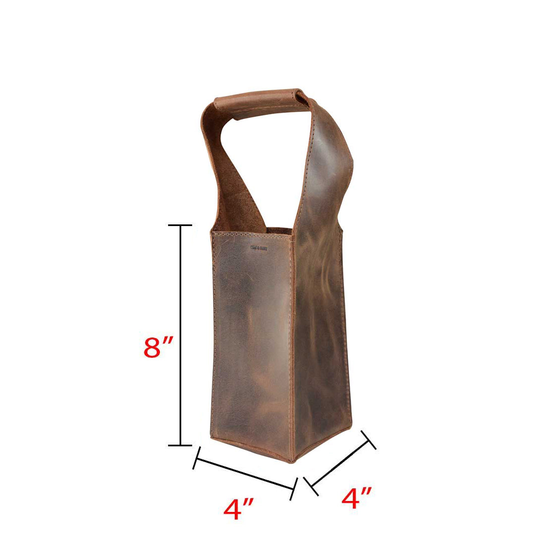 The Bottle Wine Carrier by Hide & Drink alongside measurement details, illustrating its squared format with a handle. This bottle wine carrier serves as a functional Bordeaux bottle holder and stylish rustic case for picnics. Crafted from full grain leather, it emphasizes small batch production and artisan skills with hand cut and hand sewn quality, fire branded in La Antigua Guatemala and Oaxaca Mexico.