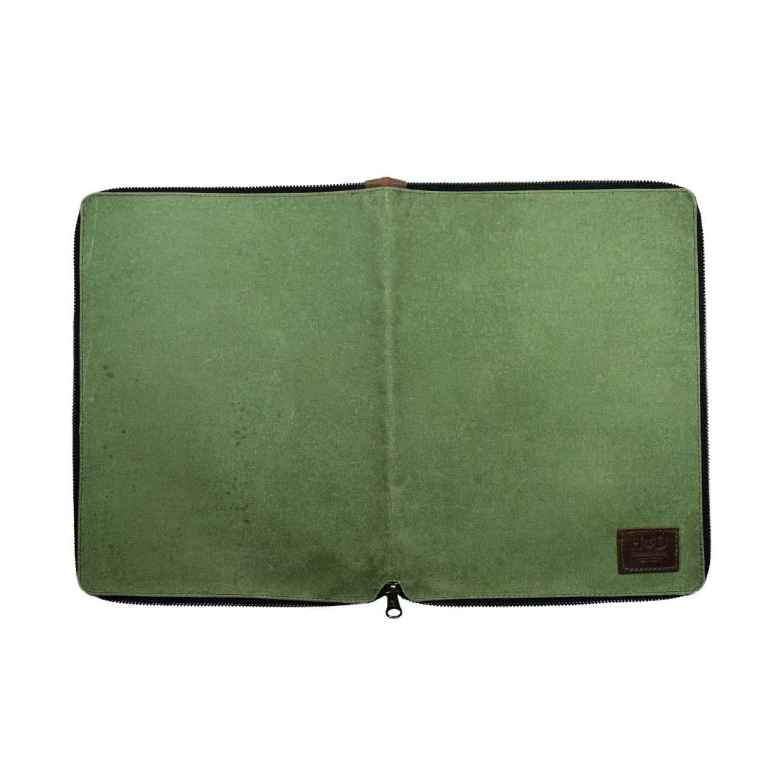 Back view of the Waxed Canvas Zippered Journal Cover for Moleskine (Notebook NOT Included) by Hide & Drink, showcasing the minimalist design in green Waxed Canvas. An ideal Cahier Case for creative minds, featuring durable Full Grain Leather, hand-cut and hand-sewn by artisans from La Antigua Guatemala & Oaxaca Mexico.