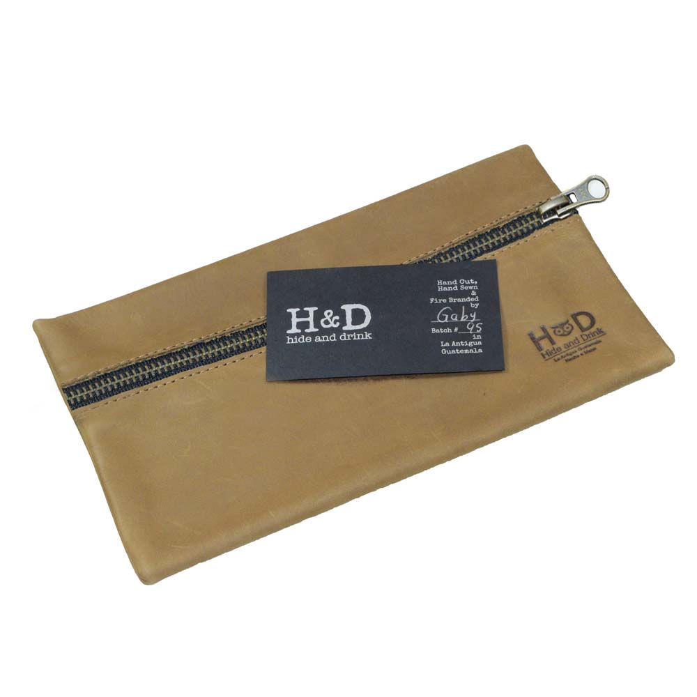Hide & Drink Utility Cord Pouch highlighted against a soft background, emphasizing its stylish design. This versatile utility & charger case for MacBook, iPad & Laptop also serves as a compact cable organizer, crafted with care in La Antigua Guatemala & Oaxaca Mexico.