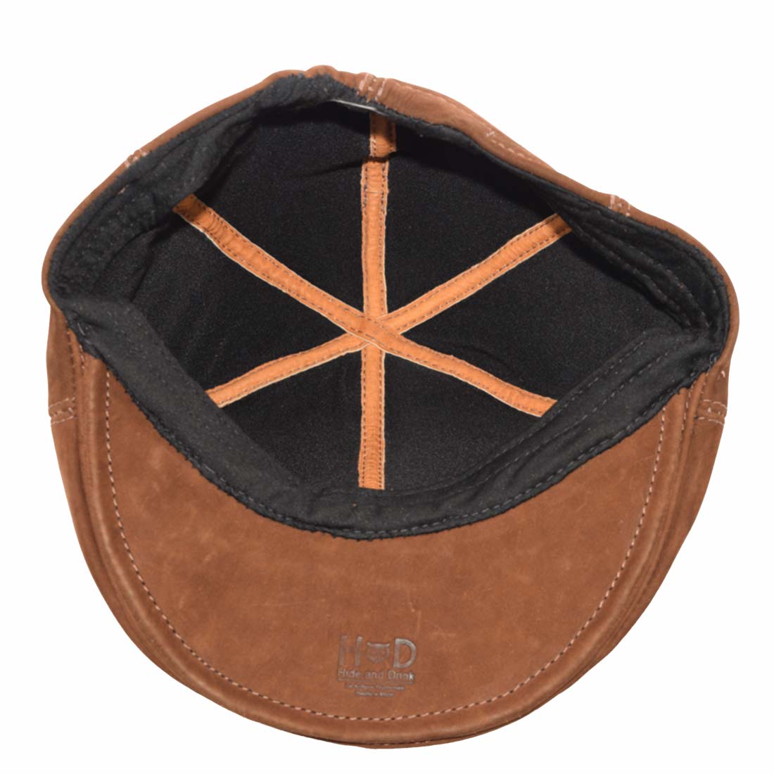 Interior view of a men's driver's cap by Hide & Drink, displaying the comfortable lining and craftsmanship. This vintage cap is made from high-quality suede and full grain leather, ensuring both durability and style. Perfect for men who appreciate artisan goods, handmade in La Antigua Guatemala & Oaxaca Mexico.