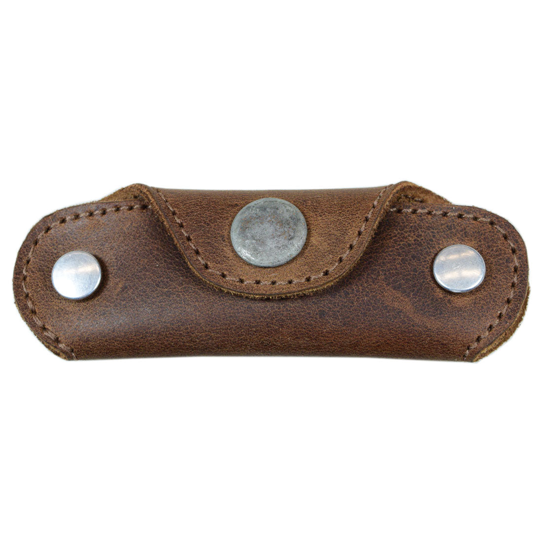Top view of Hide & Drink's Double Swiss Knife Key Holder in brown Full Grain Leather. This durable Multiple Key Organizer highlights the craftsmanship of small batch production with its artisan, hand cut, and fire branded details.