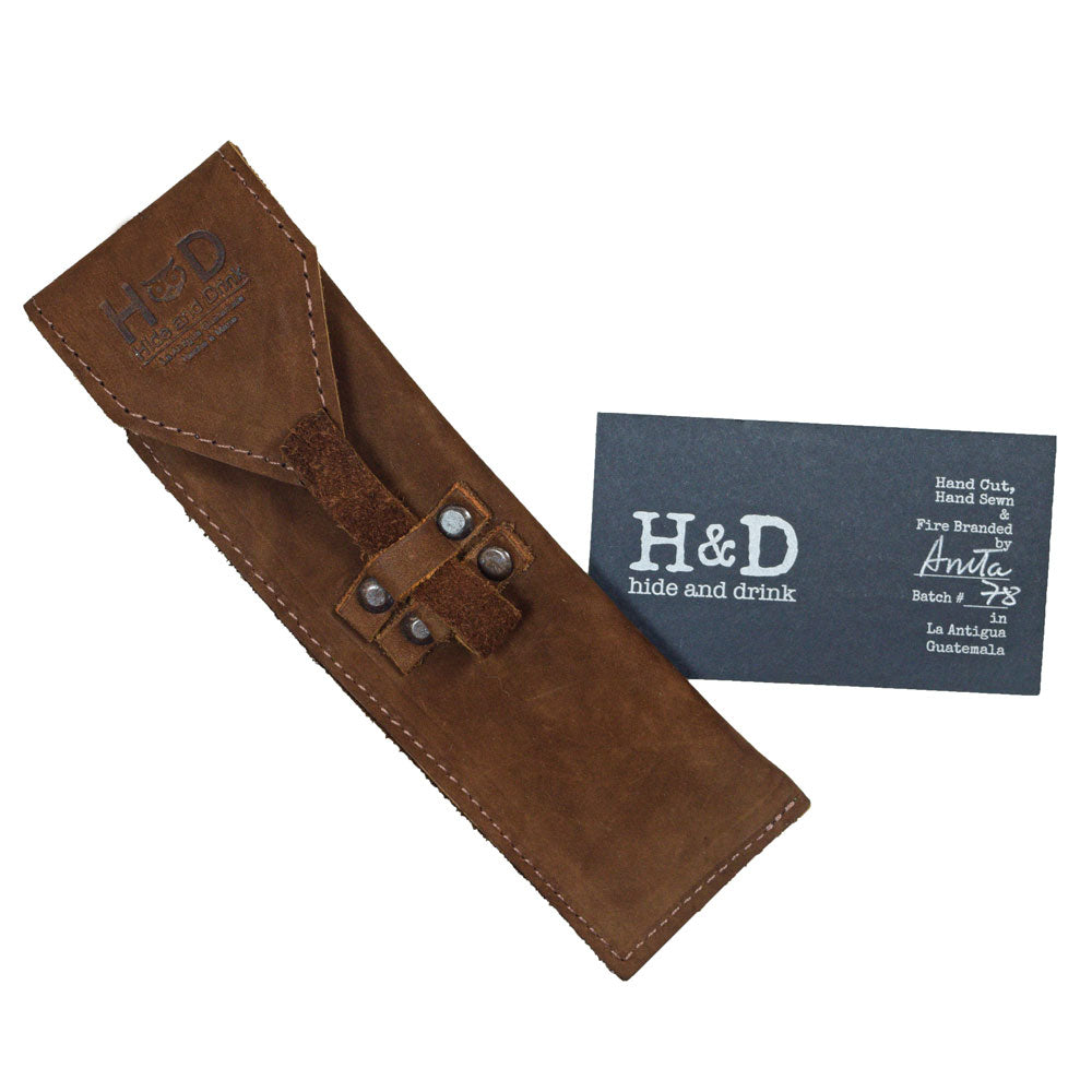 Hide & Drink Straight Razor Cover, elegantly designed with a brown leather exterior. Made from Full Grain Leather, this cover is an embodiment of Small Batch Production, Hand Cut, Hand Sewn, and Fire Branded craft, created by artisans in La Antigua Guatemala & Oaxaca Mexico.