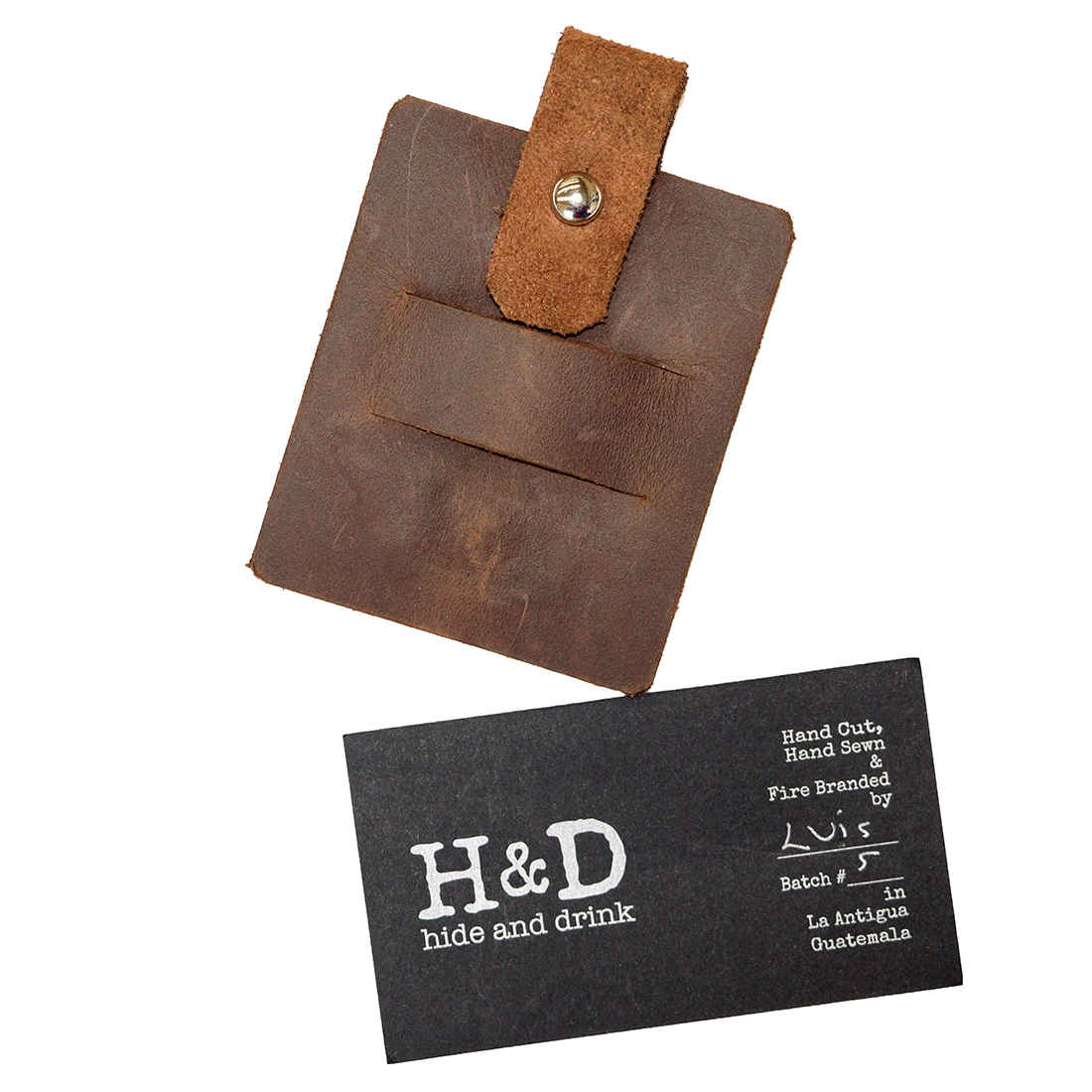 Hide & Drink Cable Holder with hand branded details, crafted from thick full grain leather, designed for organizing wired headphones and chargers. This handmade item showcases the artisan skills of small batch production in La Antigua Guatemala & Oaxaca Mexico.
